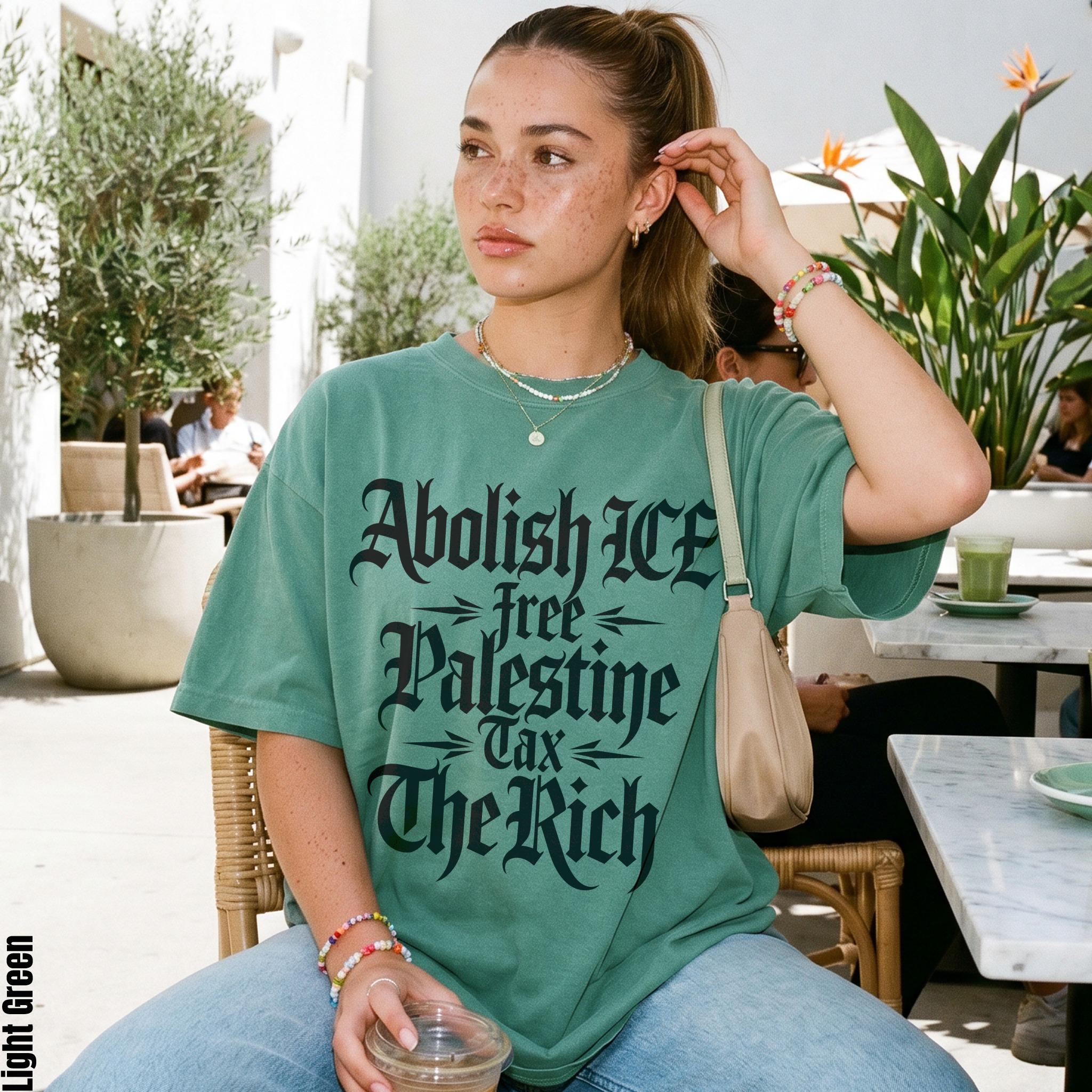 Green t-shirt with text: Abolish ICE, free Palestine, tax the rich.