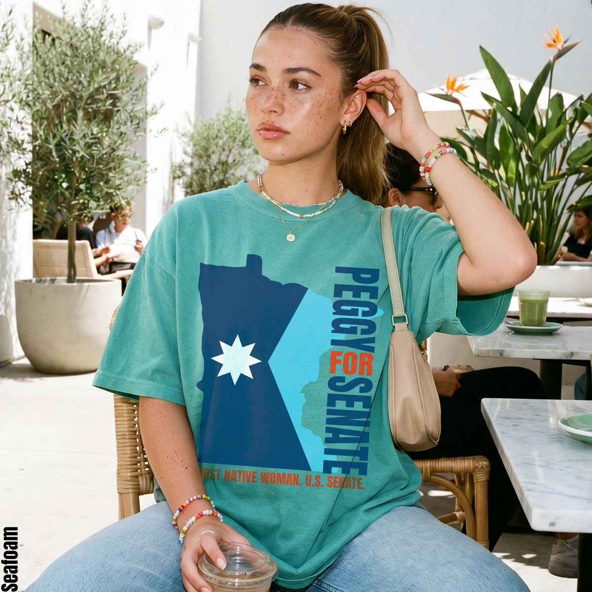 Teal t-shirt with "Peggy for Senate" and "First Native Woman, U.S. Senate" text.