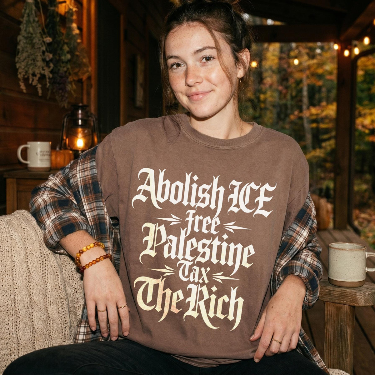 Brown sweatshirt with "Abolish ICE, Free Palestine, Tax The Rich" text.