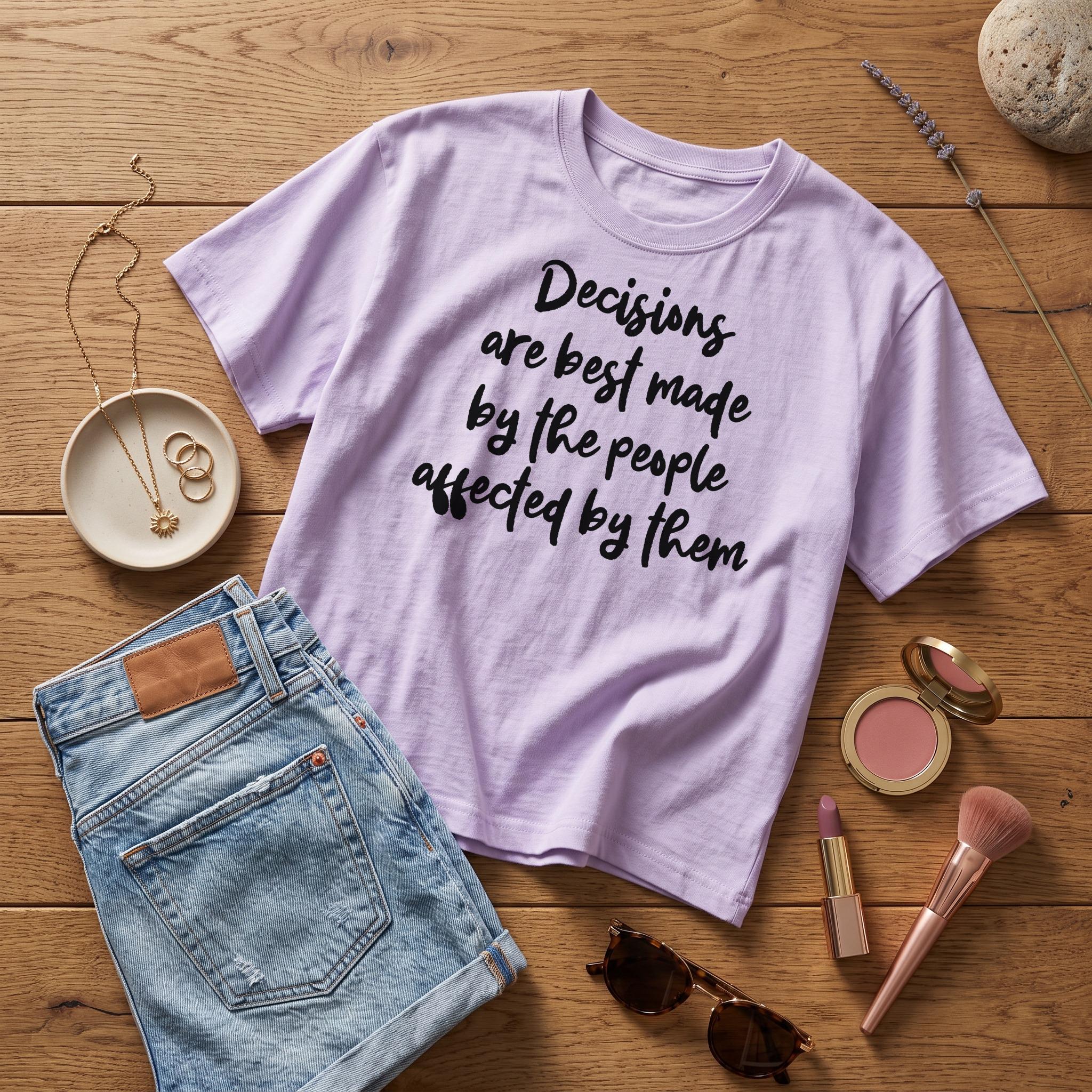 Light purple t-shirt with "Decisions are best made by the people affected by them" text.