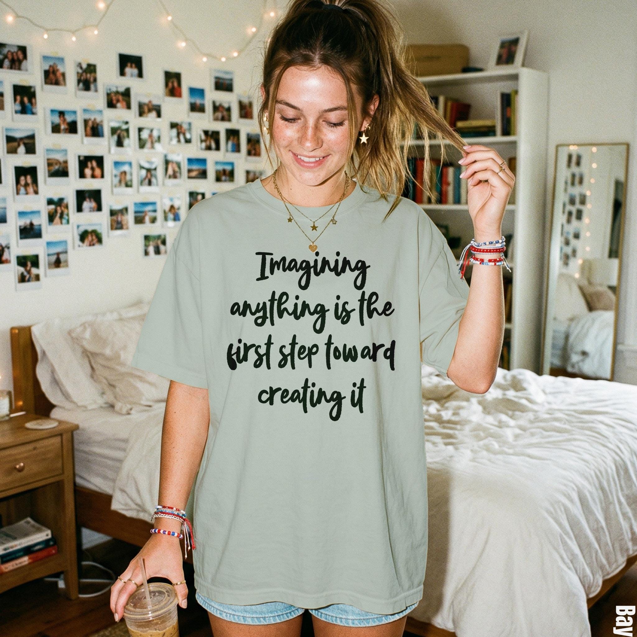 T-shirt with text "Imagining anything is the first step toward creating it".