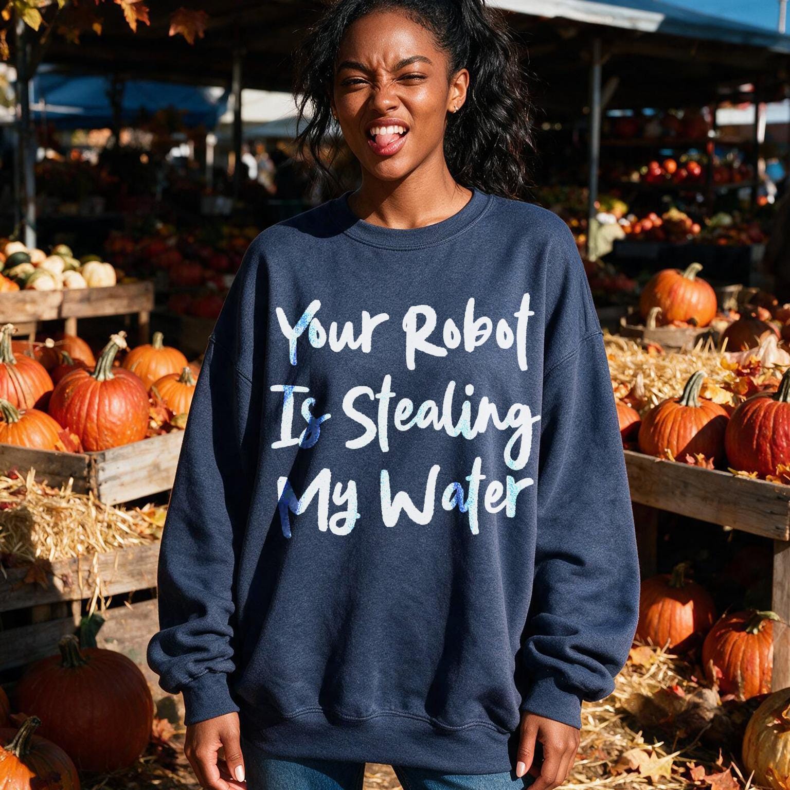 Navy sweatshirt with "Your Robot Is Stealing My Water" text at a pumpkin patch.