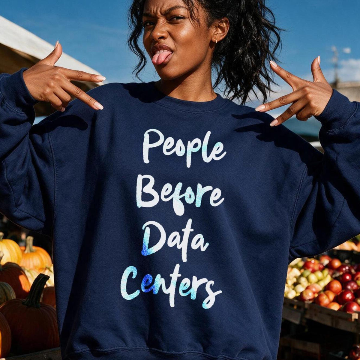 Navy sweatshirt with "People Before Data Centers" text in white and blue gradient.