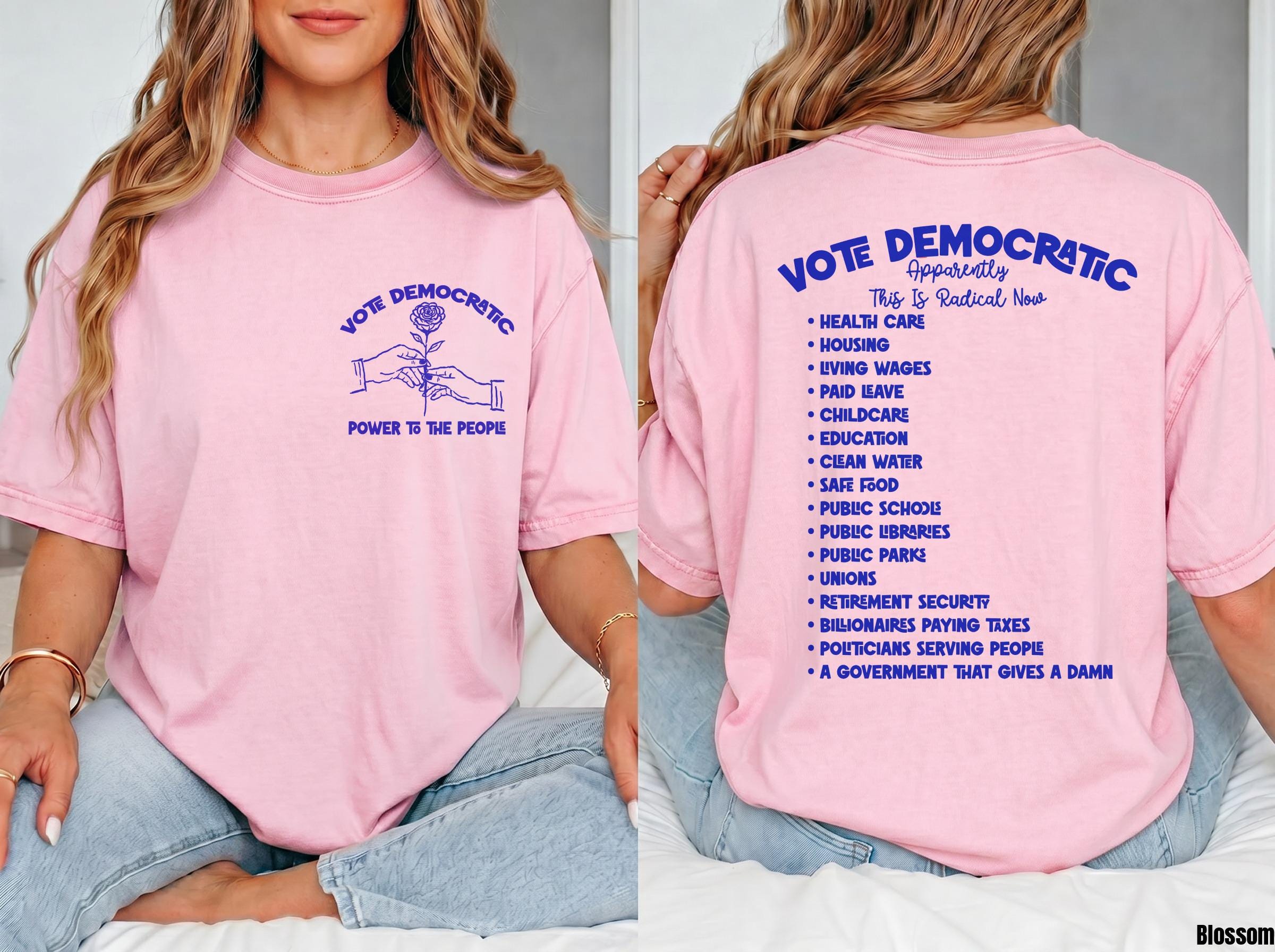 Pink t-shirt with "Vote Democratic" and "Power to the People" designs.