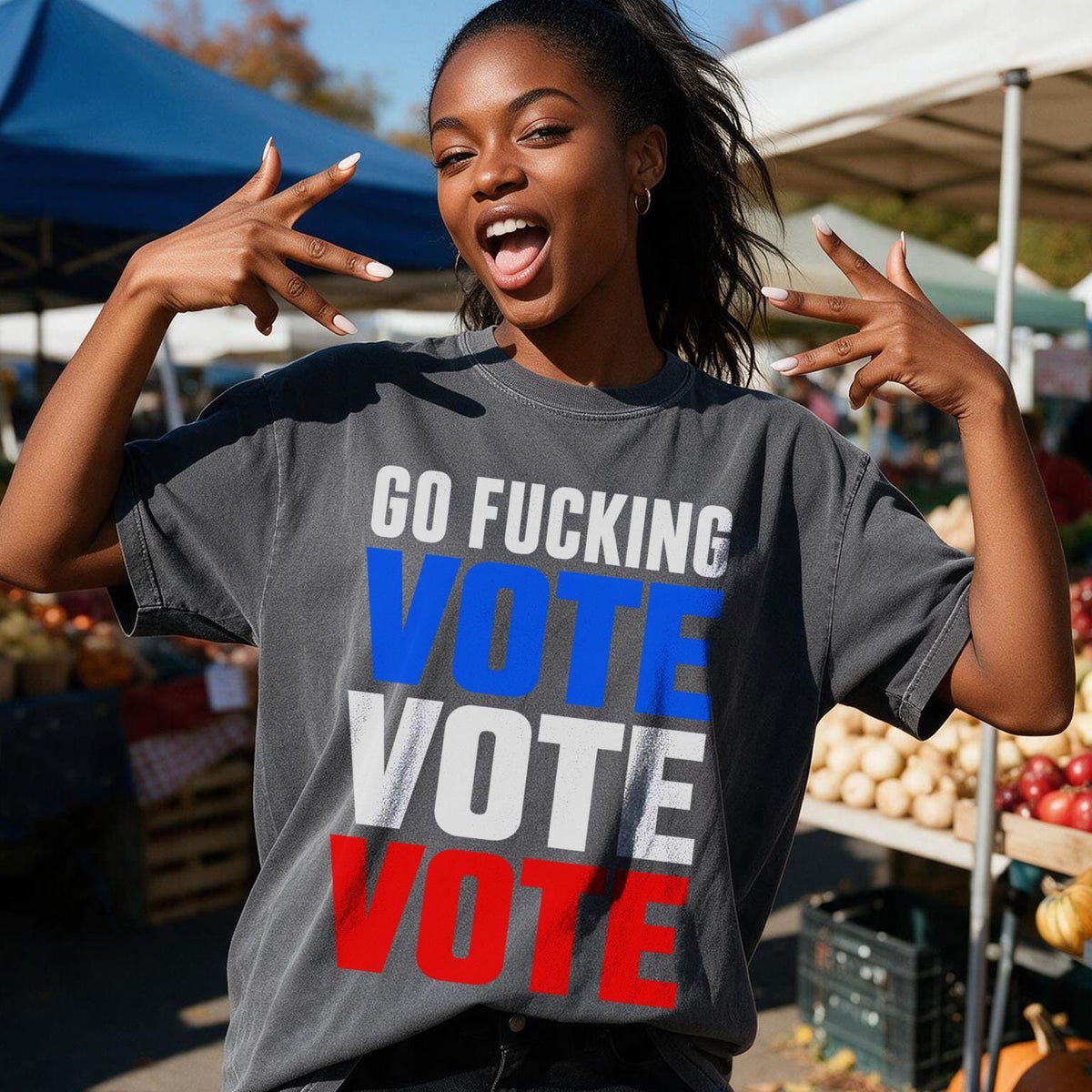 Woman in t-shirt with "GO FUCKING VOTE VOTE VOTE" in patriotic colors.