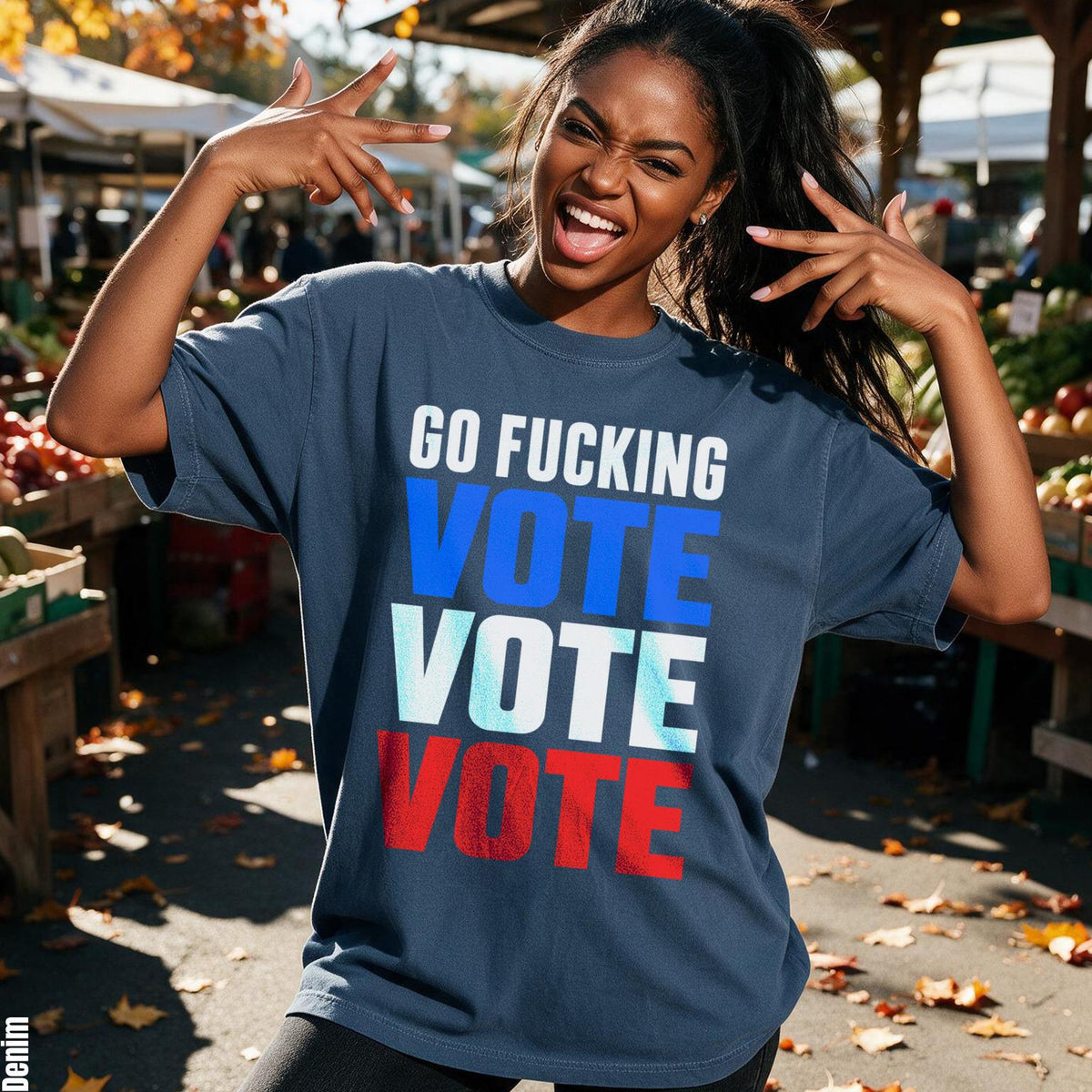 Woman wears navy t-shirt with "GO FUCKING VOTE" printed in blue and white.