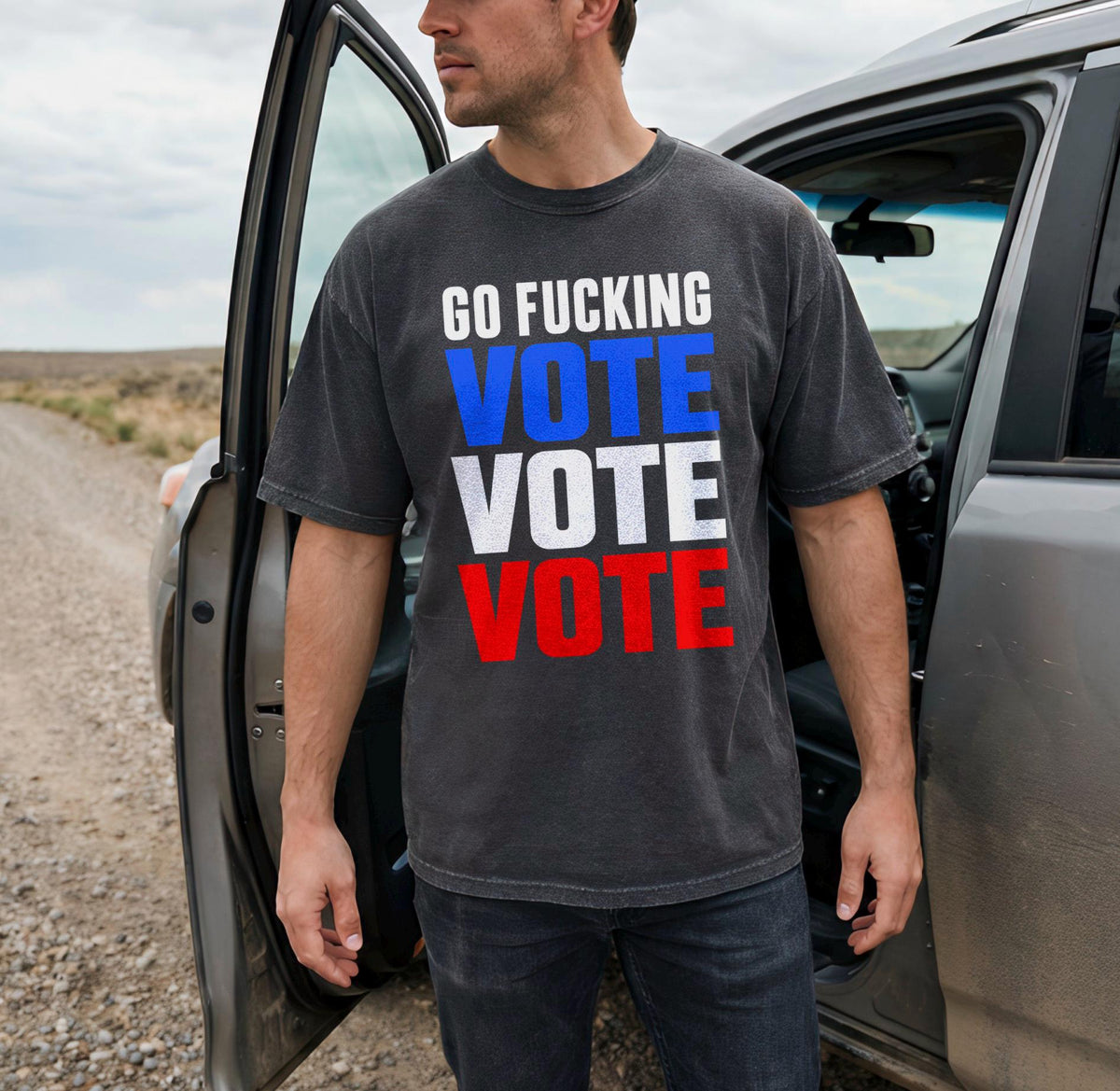 Man wearing dark t-shirt with "GO FUCKING VOTE VOTE VOTE" text.