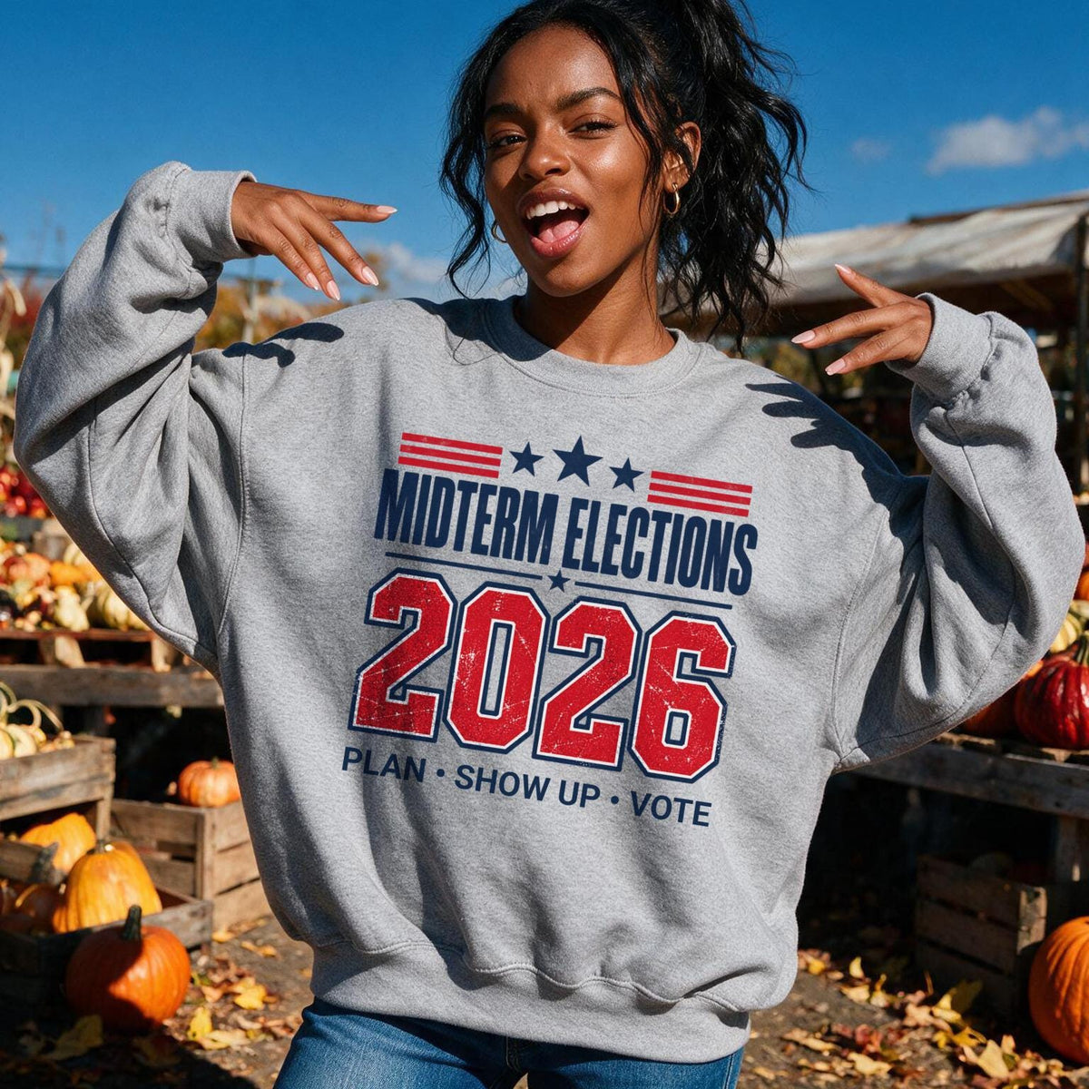 Grey sweatshirt with "Midterm Elections 2026 Plan Show Up Vote" text.