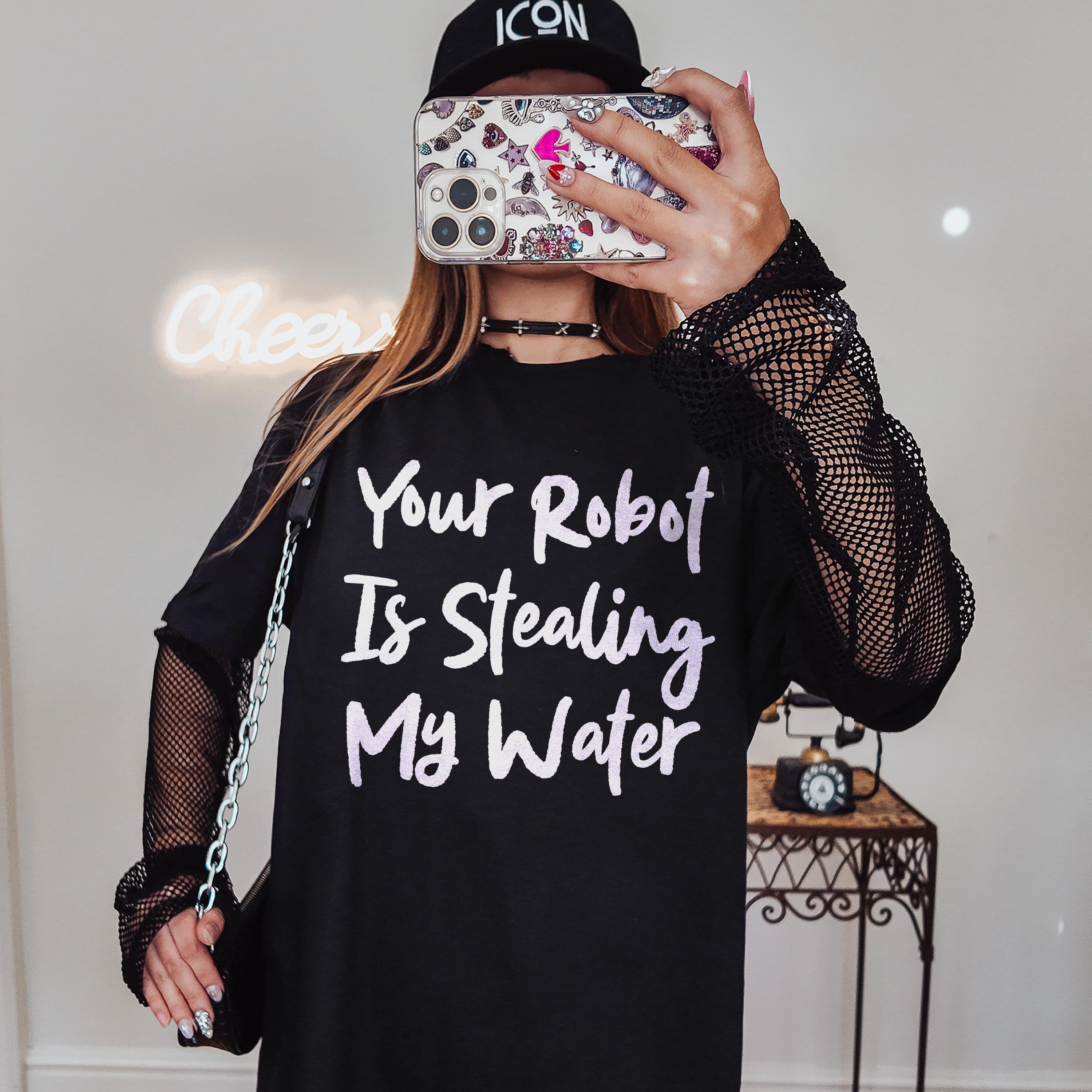 Black t-shirt with "Your Robot Is Stealing My Water" text and fishnet sleeves.