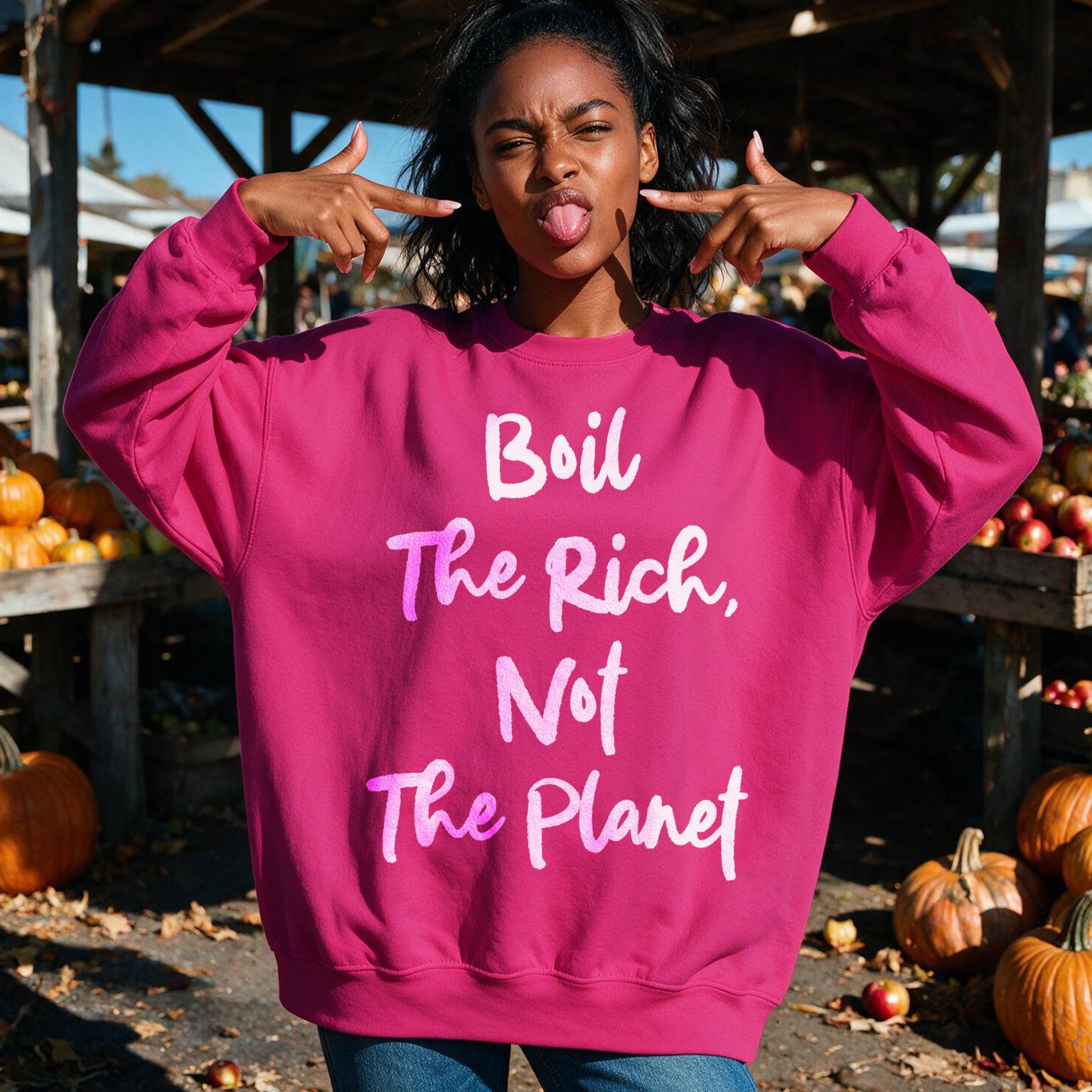 Woman wearing pink sweatshirt with "Boil the Rich, Not the Planet" text.