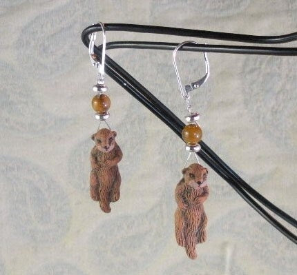 Otter Earrings - Sea Otter Jewelry displayed on a natural background to highlight the artistic craftsmanship.