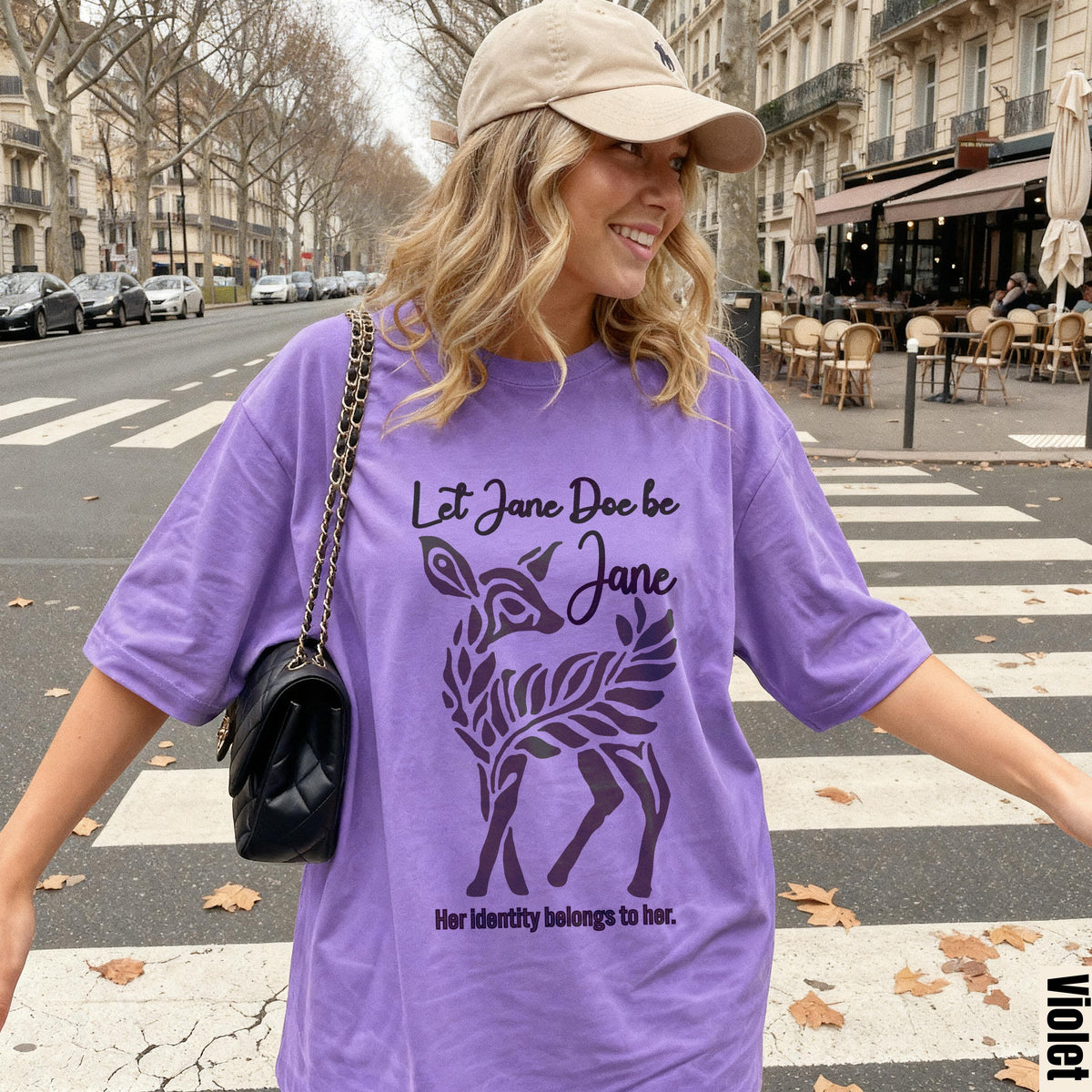 Purple t-shirt with deer graphic and text "Let Jane Doe be Jane. Her identity belongs to her."