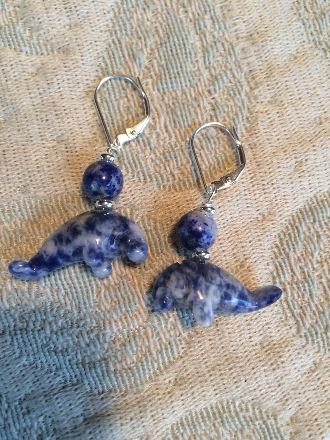 Manatee Earrings - Blue sodalite Earlobe Earrings featuring a carved stone design, perfect for beach lovers and animal enthusiasts.