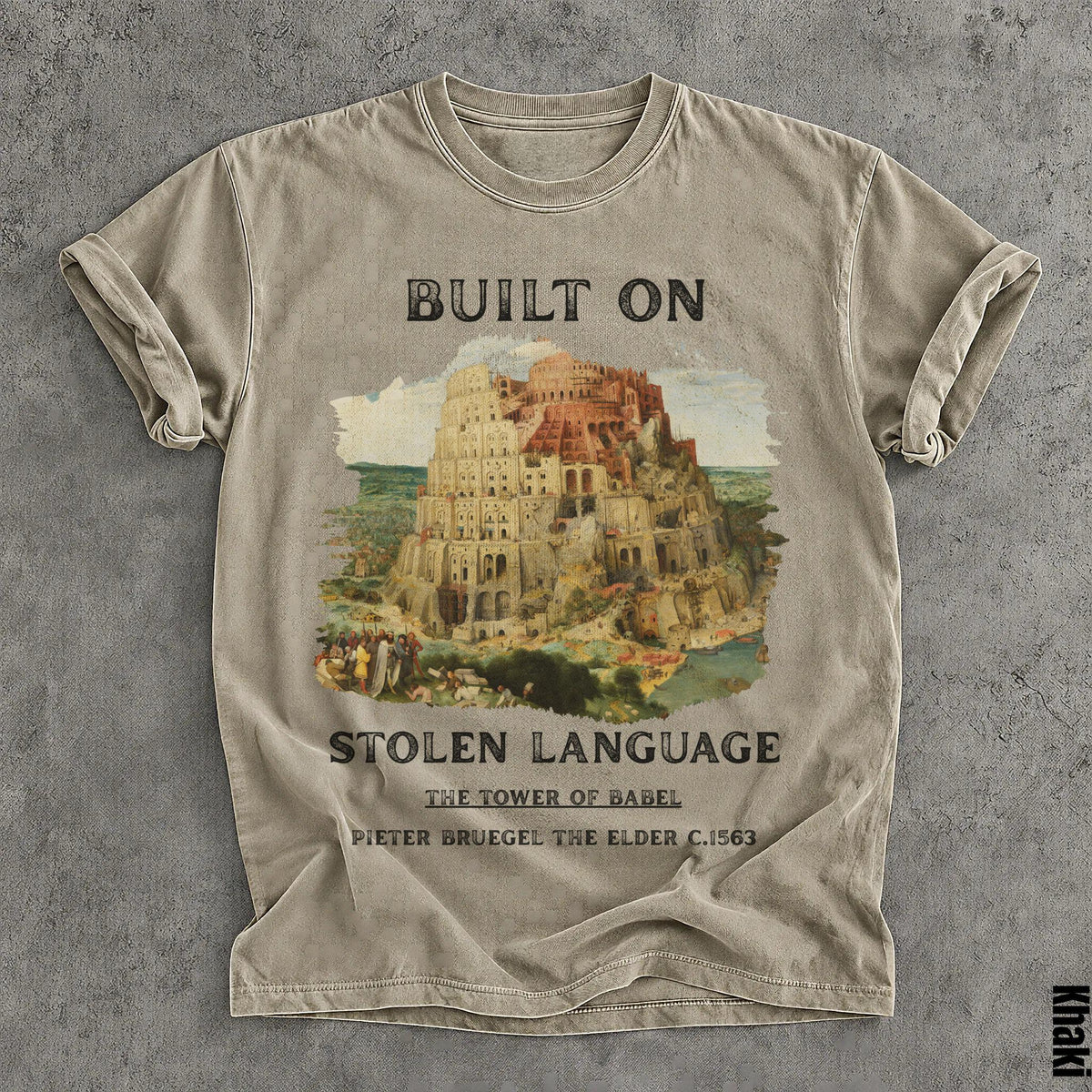 T-shirt with "BUILT ON STOLEN LANGUAGE" and Tower of Babel artwork by Pieter Bruegel.