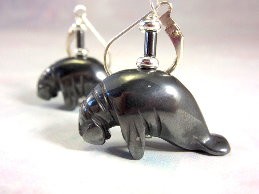 Manatee Earrings - Animal Earring, Artisan Jewelry featuring carved hematite black stone with lever-back design for dangle effect.