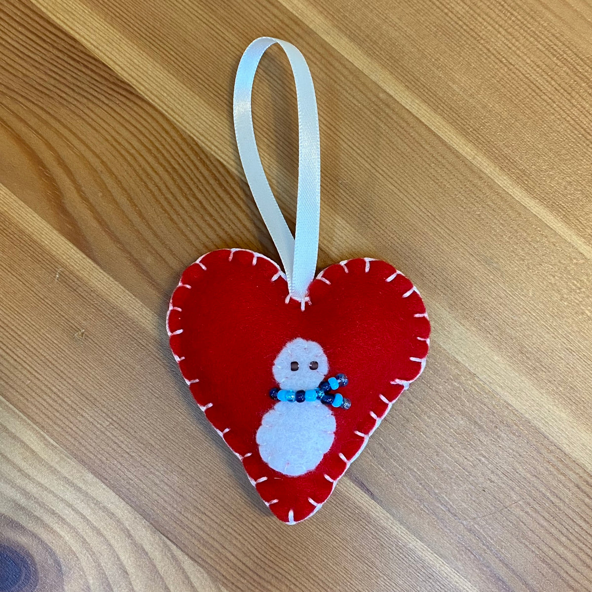 Snowman on red felt heart Christmas ornament