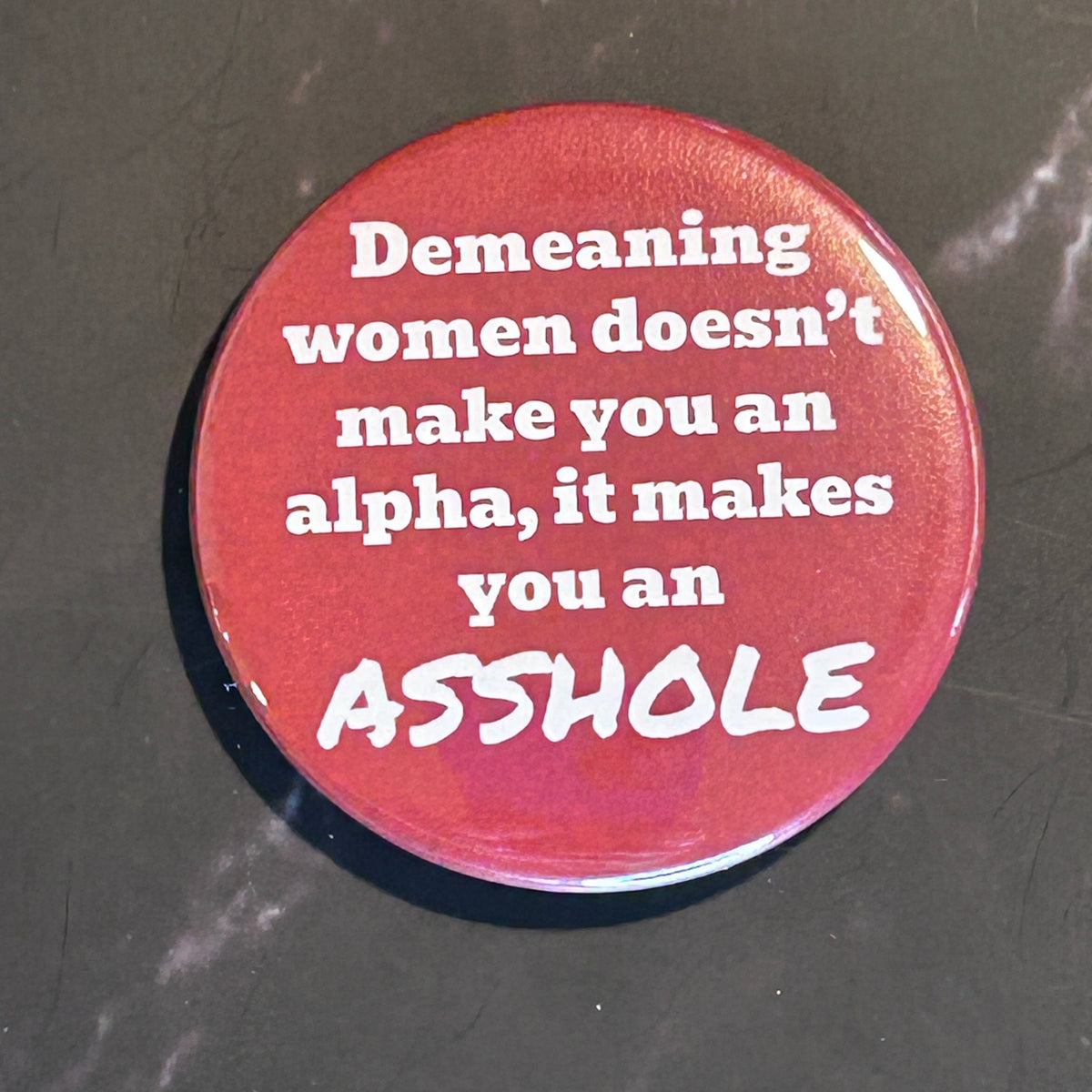 Demeaning women makes you an asshole - button/magnet/mirror