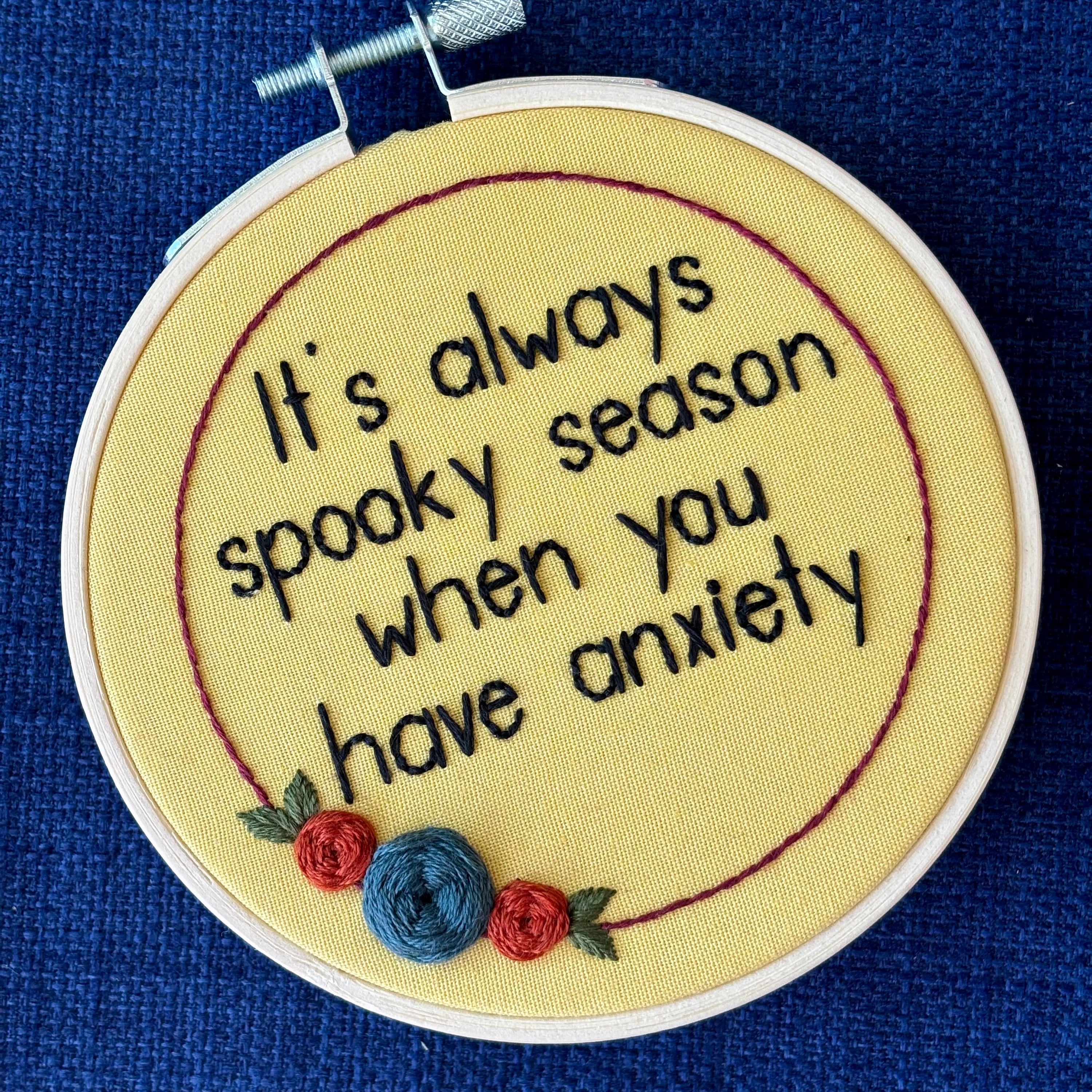 Embroidery hoop reads, "It&