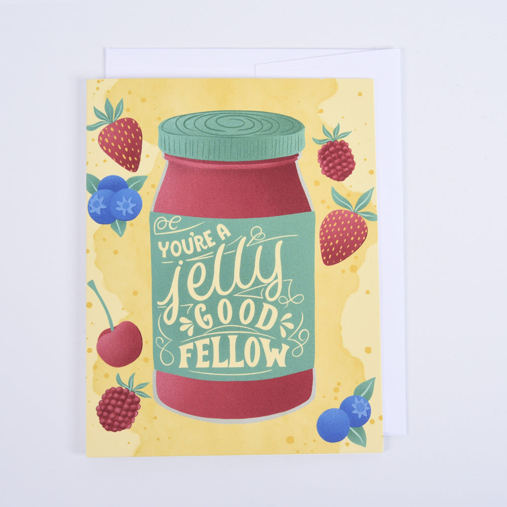 A folded greeting card with a colorful design featuring a strawberry jelly jar and the text &