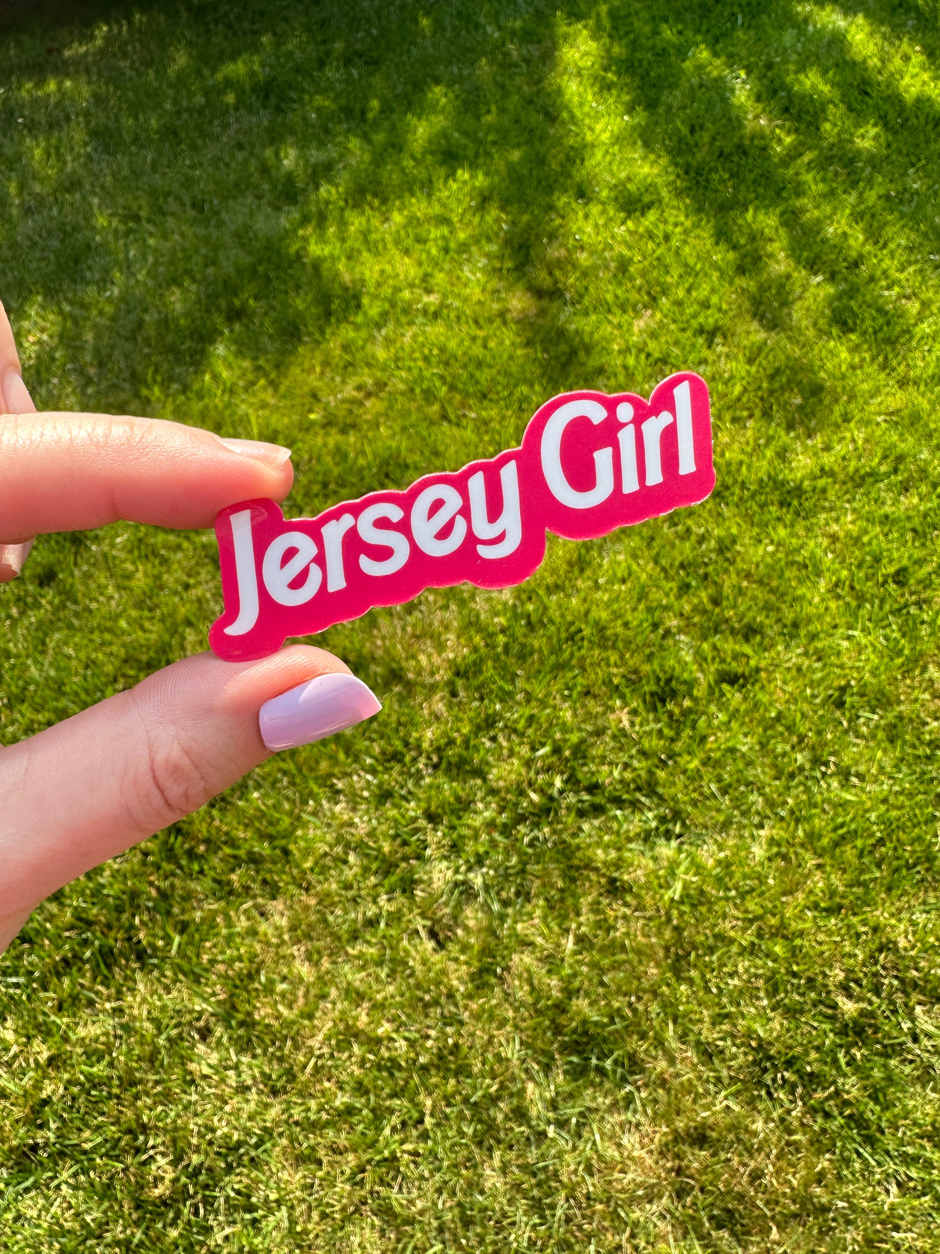 "jersey girl" is written in a white font with a hot pink offset