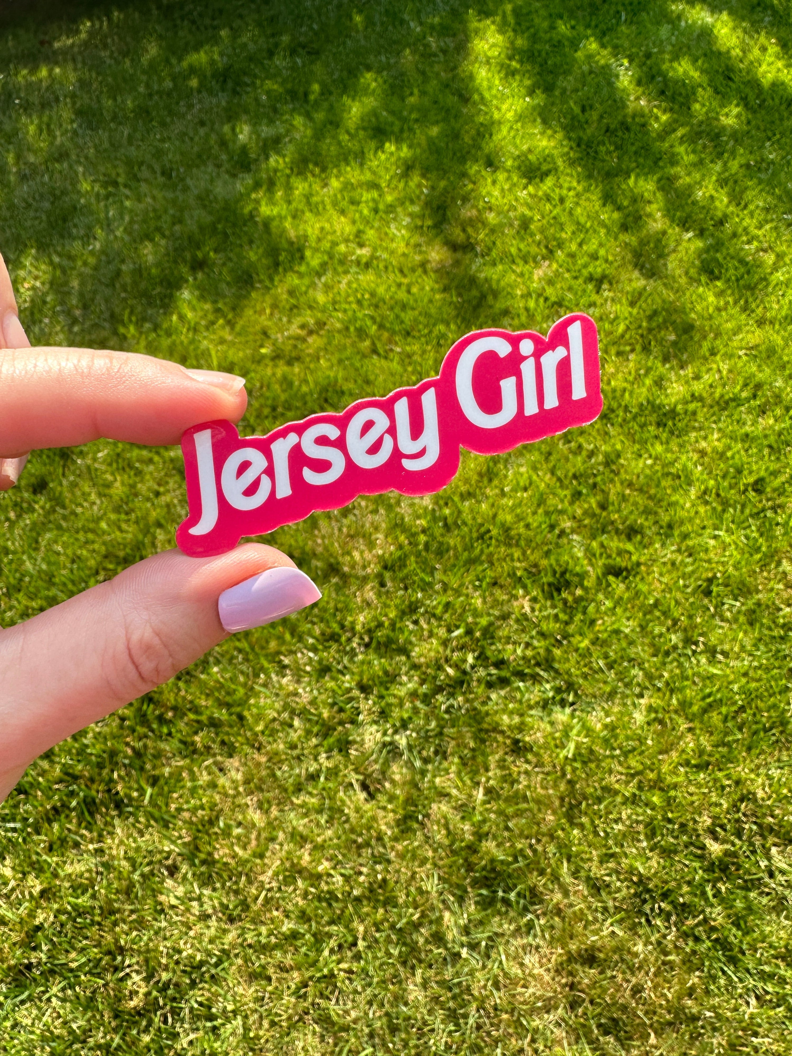 "jersey girl" is written in a white font with a hot pink offset