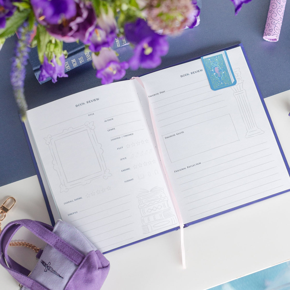 Book Club Reading Journal open to reading tracking pages with organized literary journaling layout, Jollity & Co.
