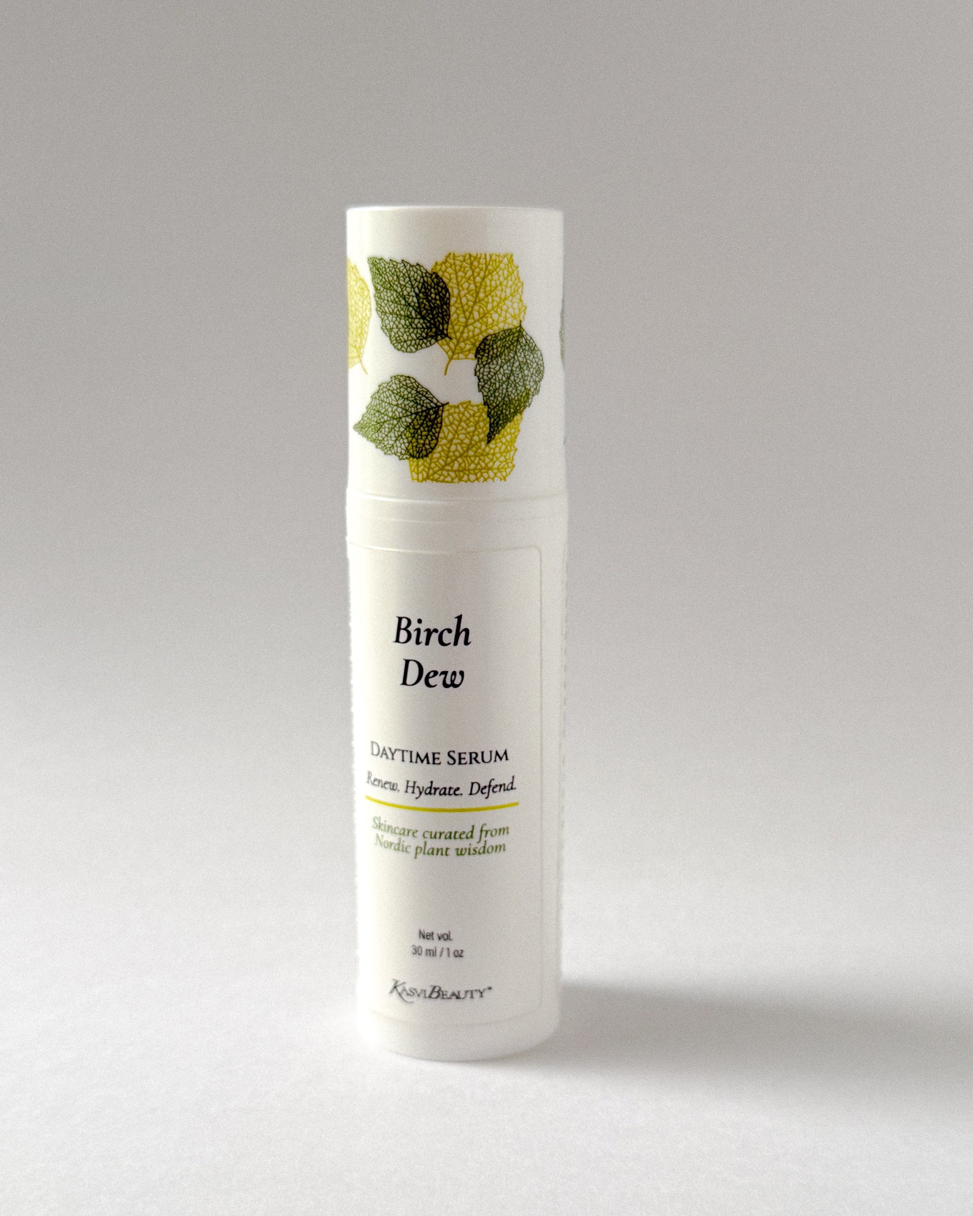 Bottle of Birch Dew Daytime Serum on a gray background