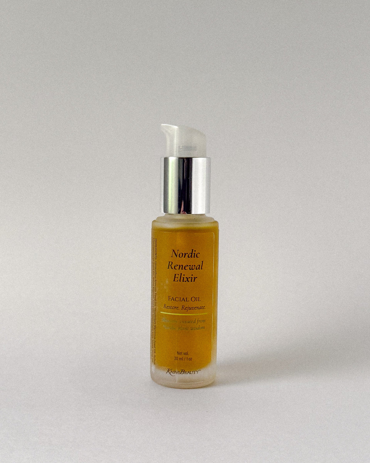 Bottle of Nordic Renewal Elixir facial oil on a light gray background