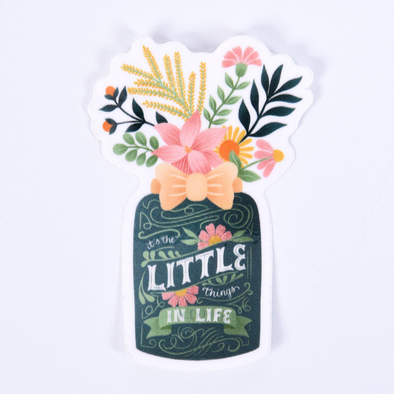 A sticker with a floral design and the phrase &