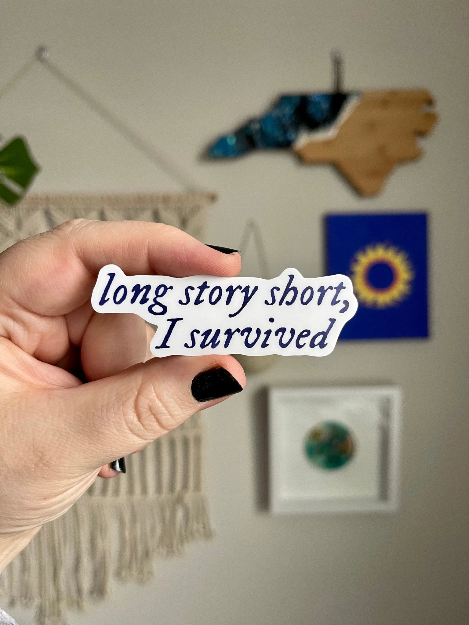Long story short, I survived sticker — navy blue hand lettered lyric in a soft folk style, waterproof vinyl sticker, by MangoIllustrated