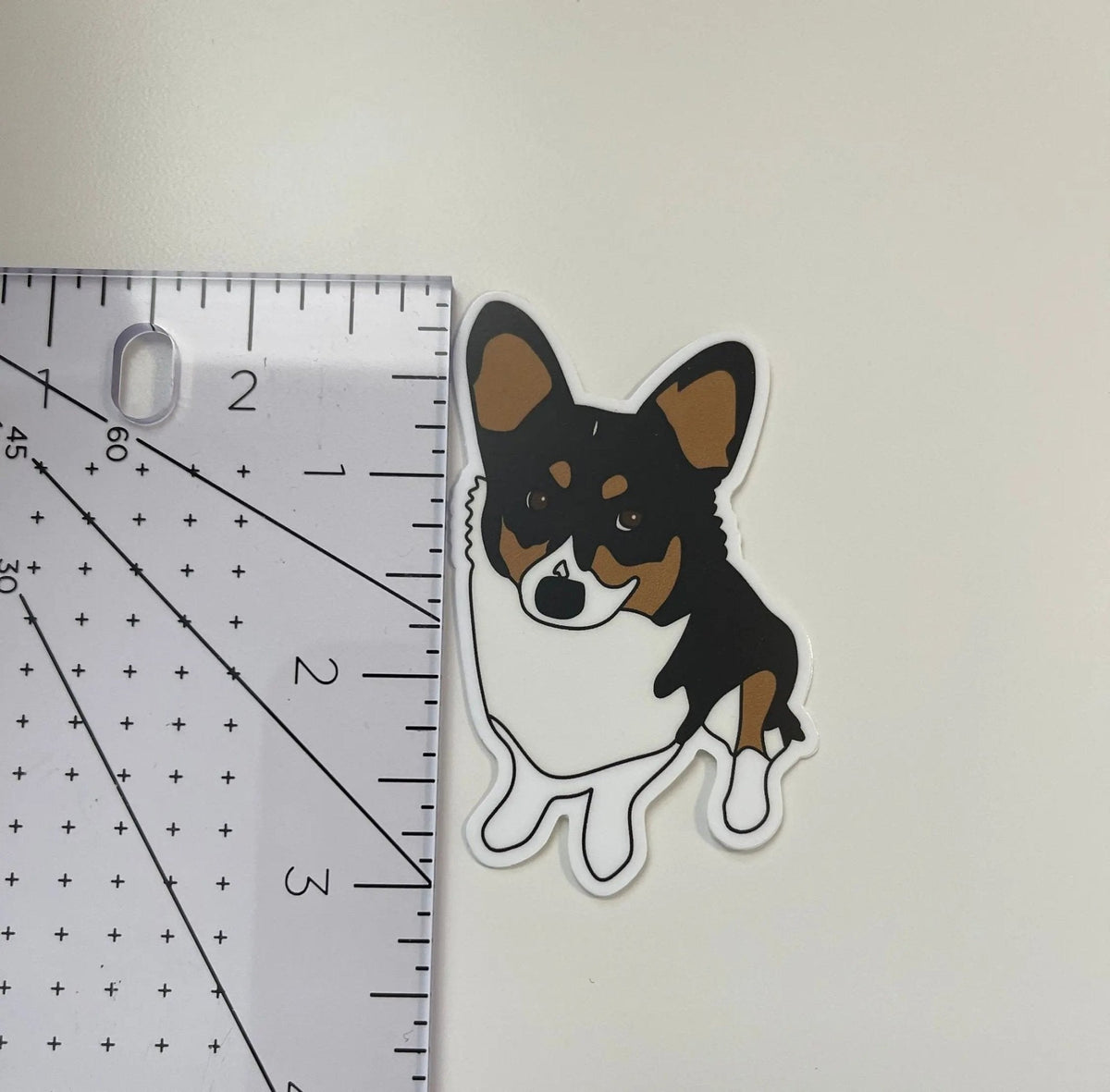 Mango the corgi sticker flat lay — cute corgi dog lover laptop and water bottle sticker by indie artist MangoIllustrated