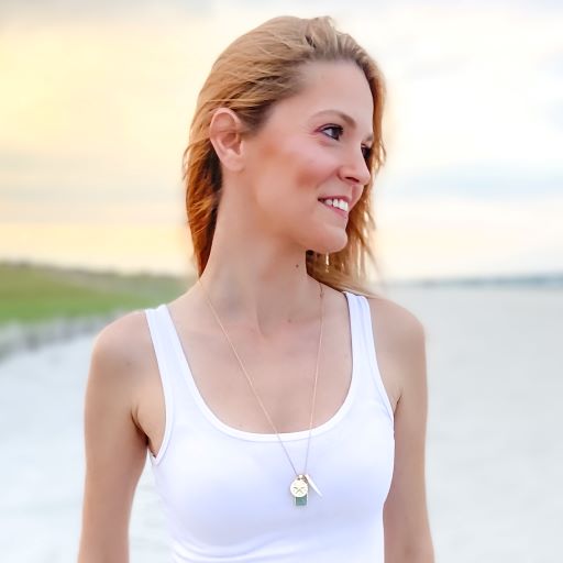 mantoloking charm necklace with amazonite pendant freshwater stick pearl and starfish charm on model in white tank top on beach