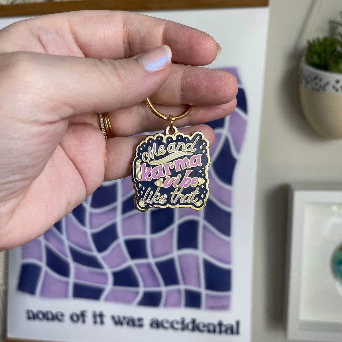 Me and Karma Vibe Like That enamel keychain back detail — reverse side of the hard enamel keyring by indie artist MangoIllustrated