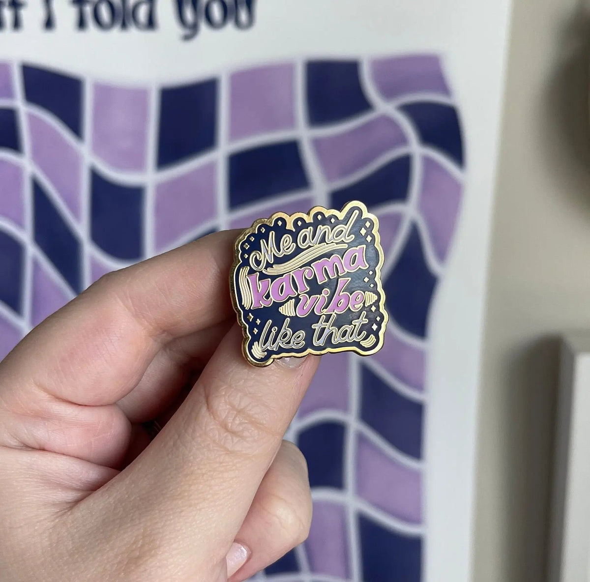 Me and Karma Vibe Like That enamel pin angled view — polished gold metal edge and navy enamel by indie artist MangoIllustrated