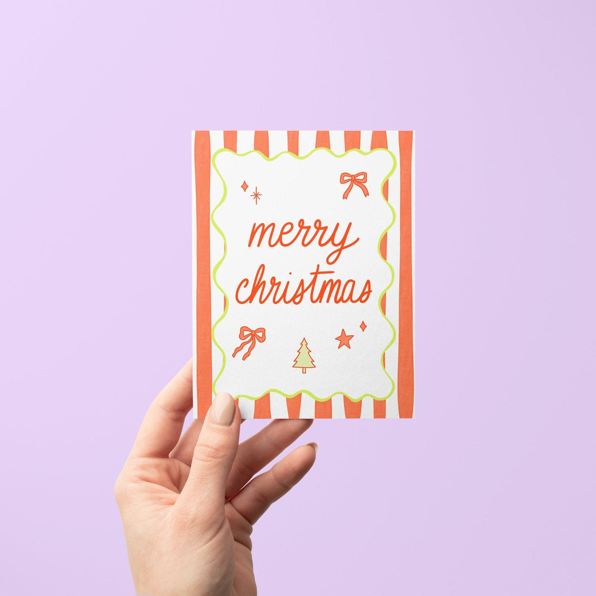 Merry Christmas Stripes holiday card with A2 kraft envelope — festive Christmas card with bow, star and tree illustrations by indie artist MangoIllustrated