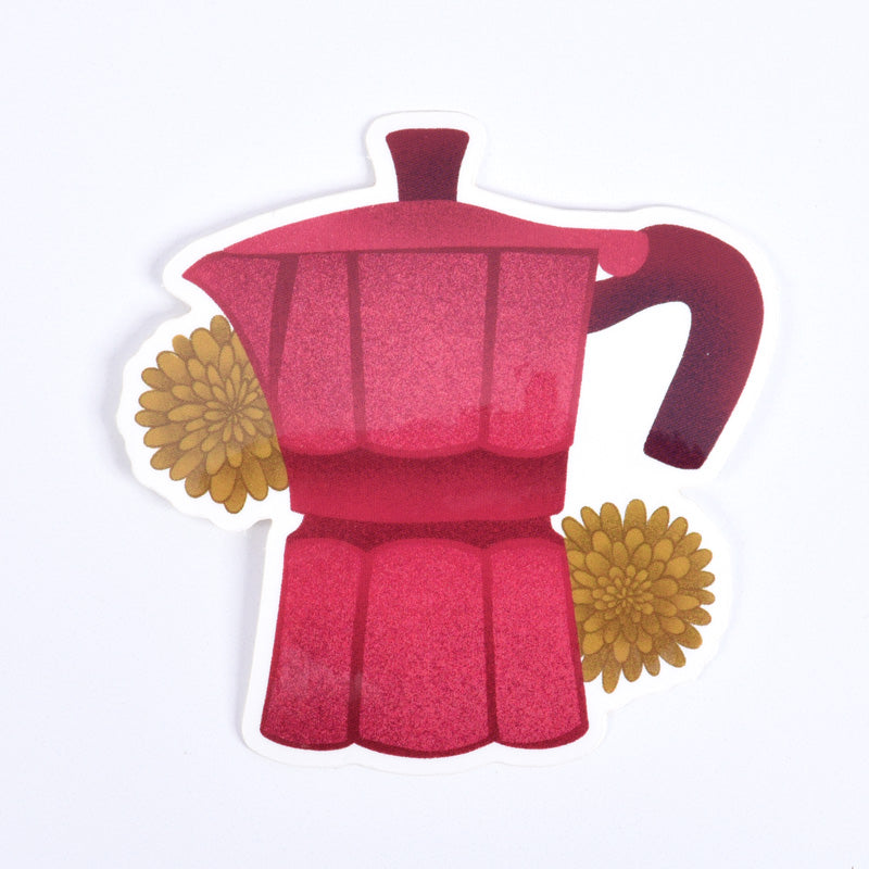 A sticker depicting a red Moka pot with yellow flowers
