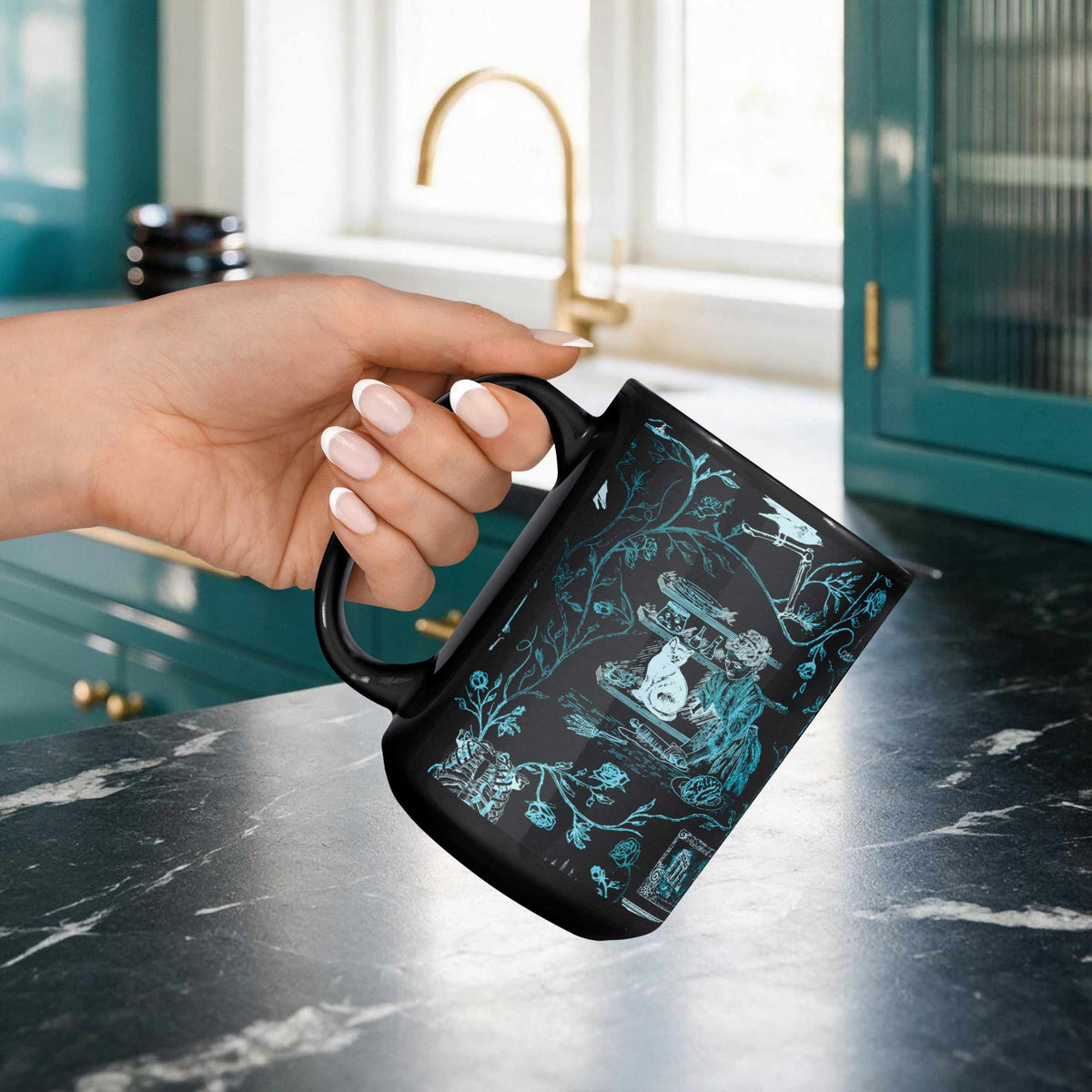 Hand holding a teal zombie toile mug over a dark marble counter in a teal and gold kitchen