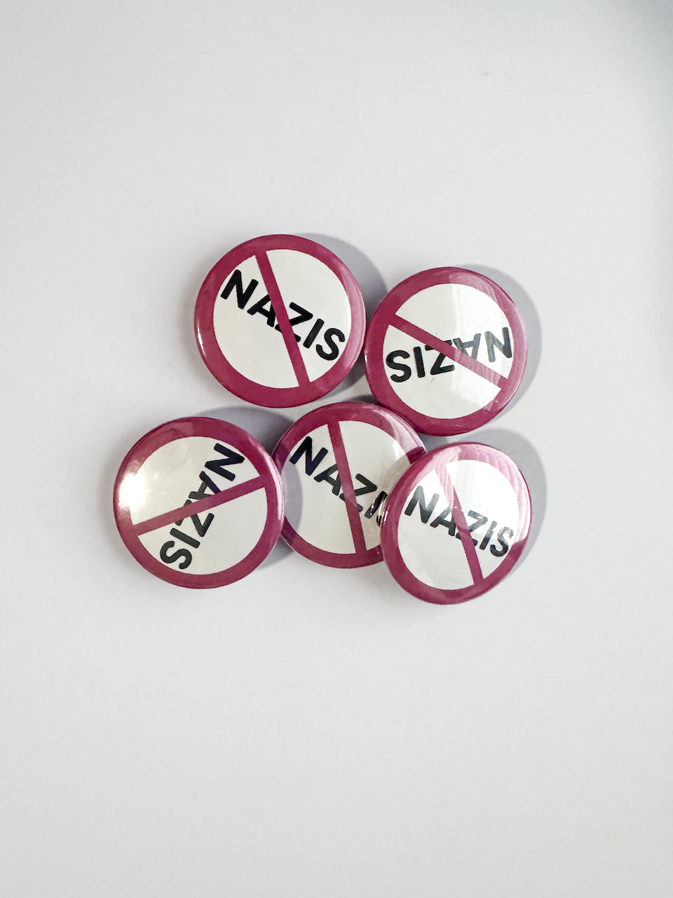 Set of anti-Nazis buttons on a white background