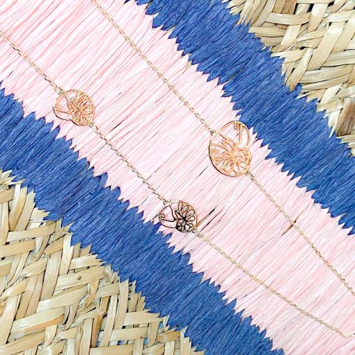 ocracoke long necklace with triple atlantic natica shells tbabnk000nk0009-gold on pink and blue basket background