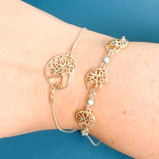 stack of ocracoke single and triple slider bracelet with atlantic natica shells with turquoise accents tbabbr0007-gold