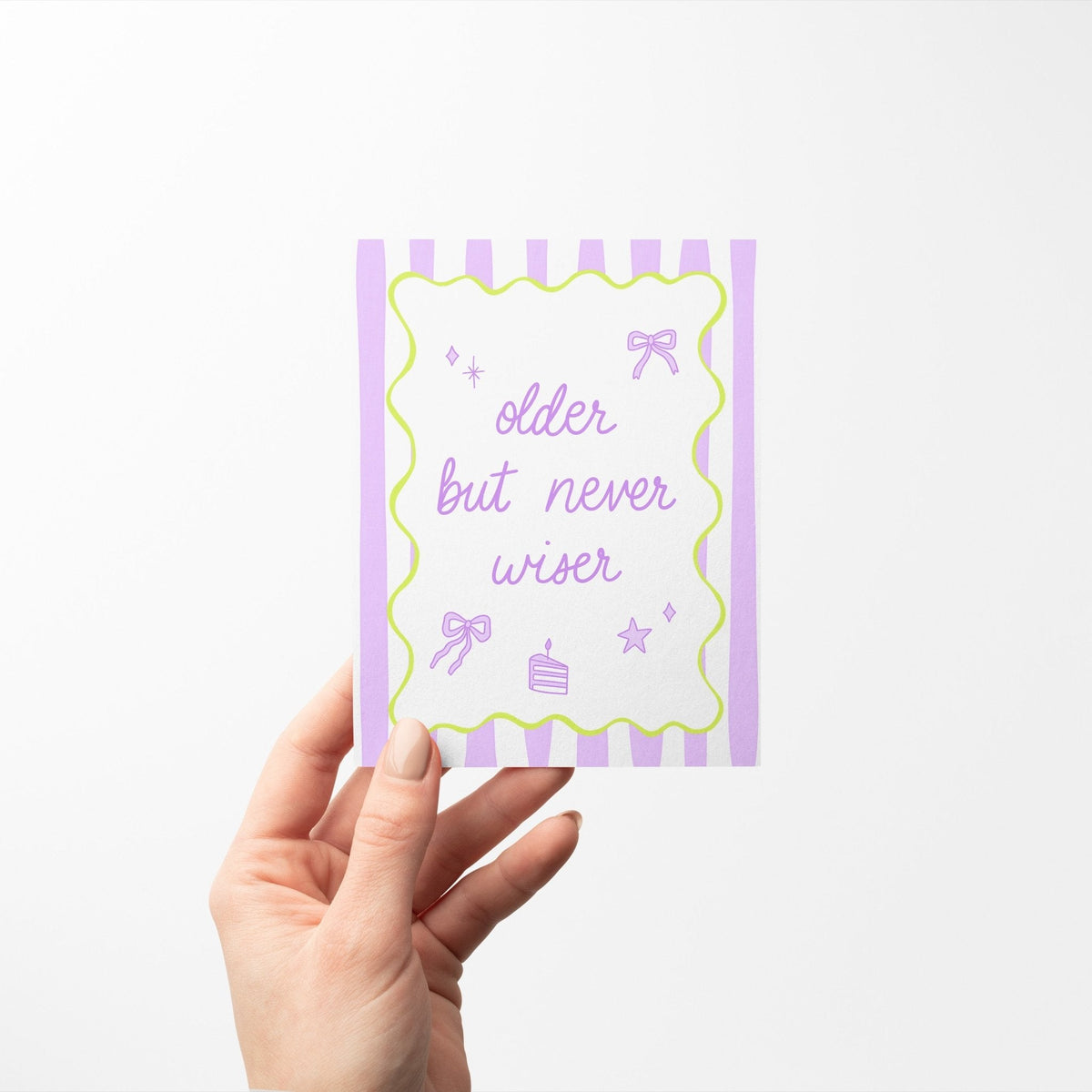 Older But Never Wiser birthday card detail — close up of the lavender script lettering and lime green wavy frame by indie artist MangoIllustrated