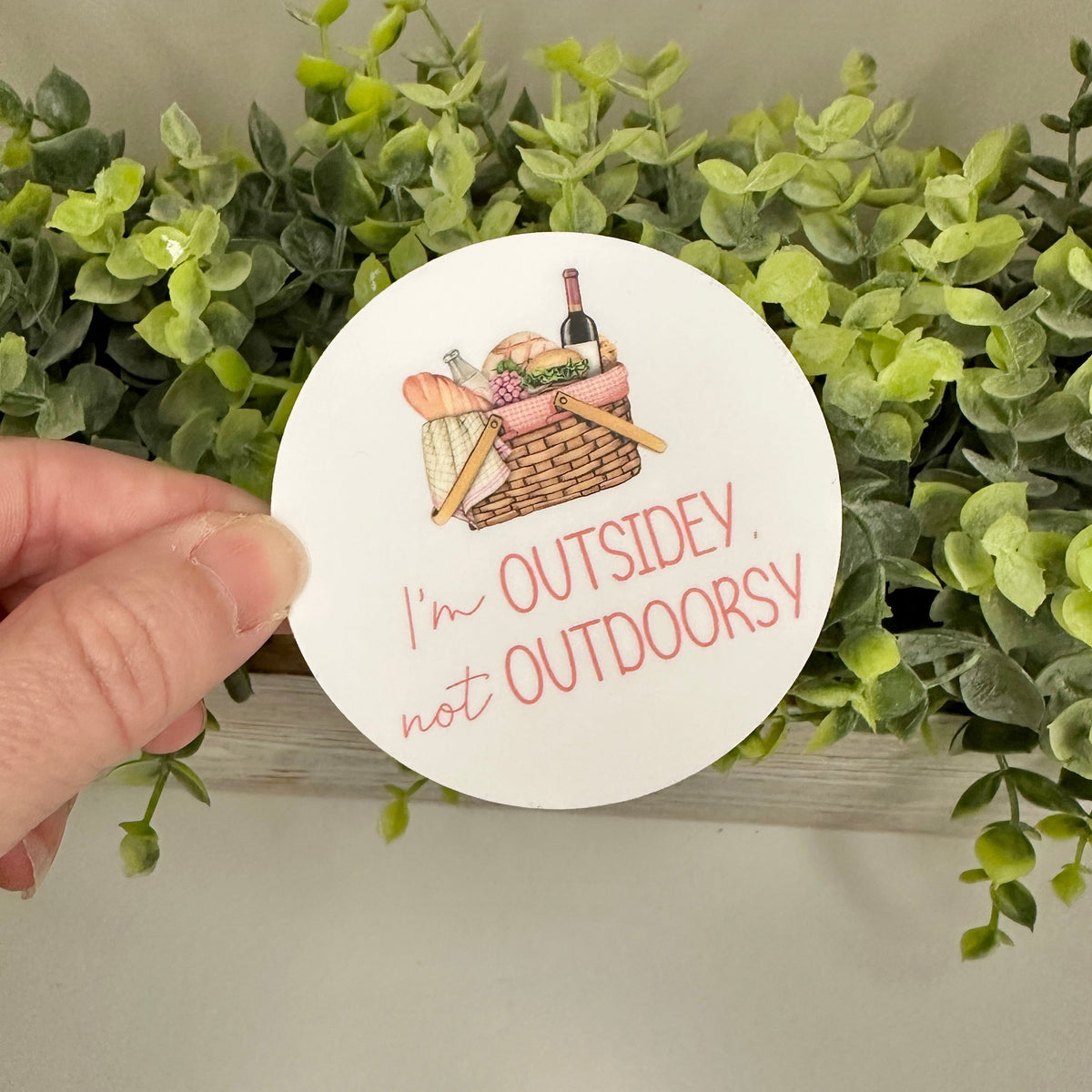 Circular sticker with picnic illustration and text &