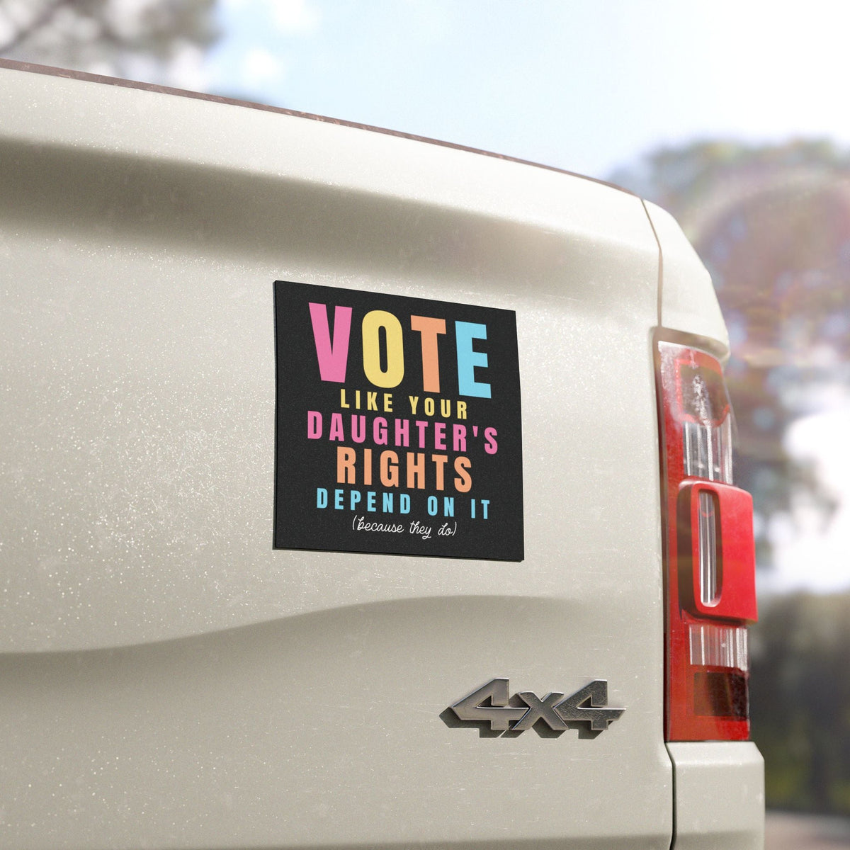 A rectangular black bumper sticker with colorful text reading &