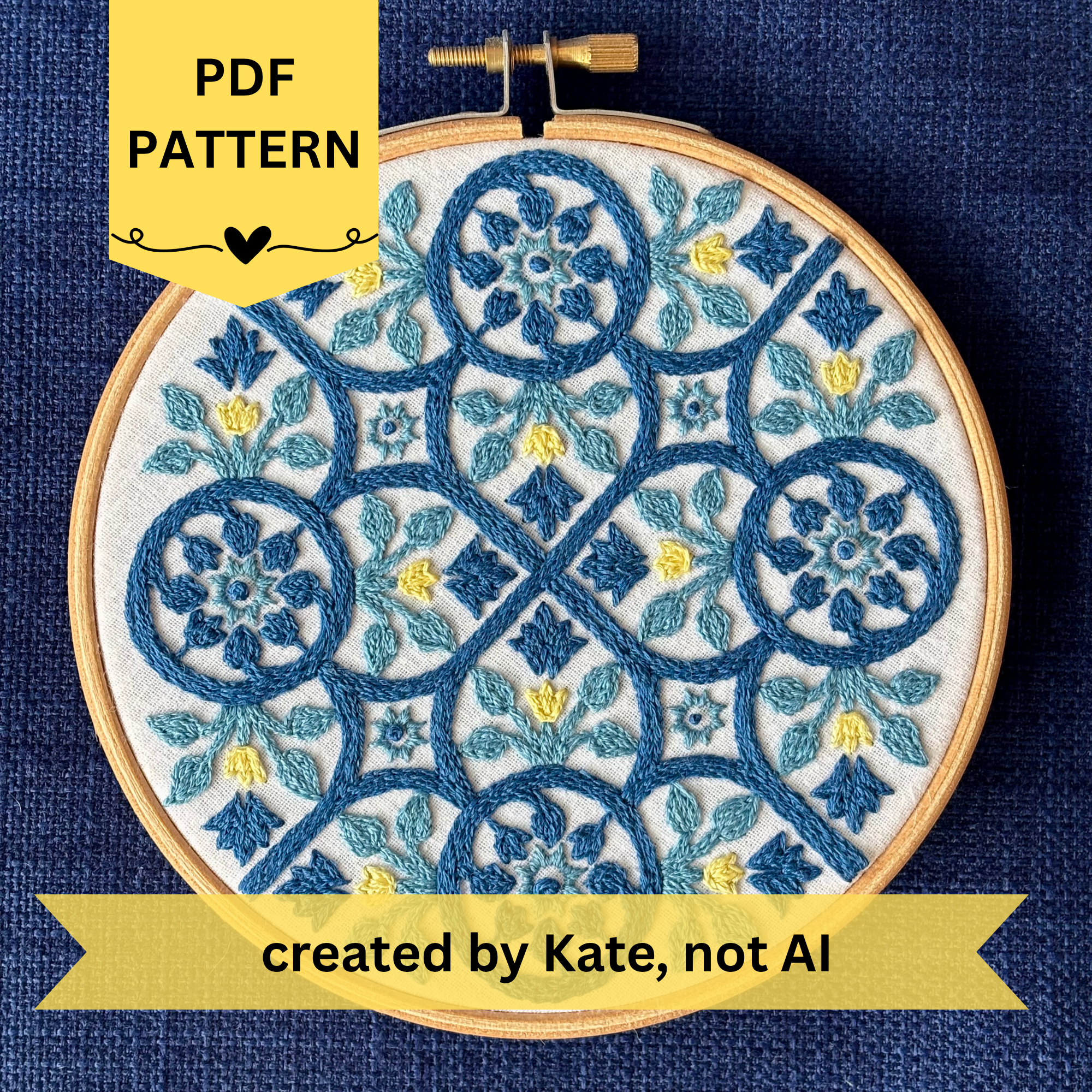 PDF Pattern created by Kate, not AI. Dark blue, light blue, and yellow embroidery based on traditional Portuguese tile with flowers, leaves, lines, and stars. Fabric is white on white cotton. Embroidery is displayed as wall art in light wood embroidery hoop.