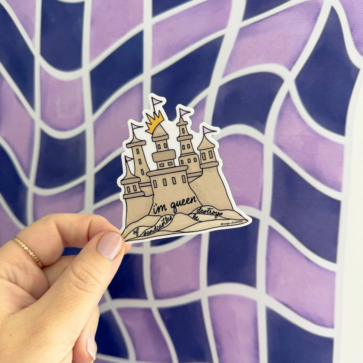 Queen of sandcastles sticker detail — hand lettered script at the sandcastle base by indie artist MangoIllustrated