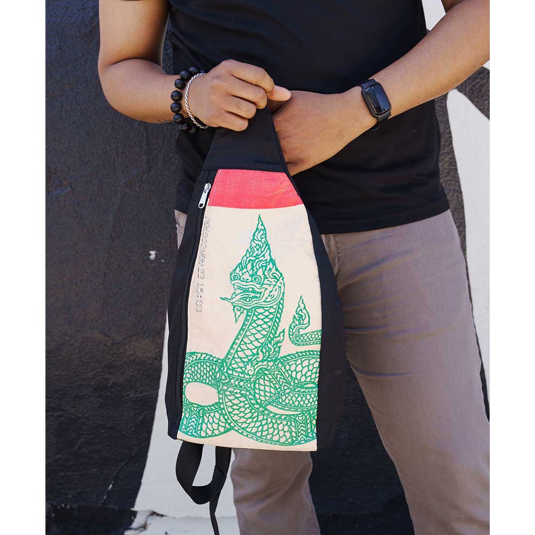 one strap sling style recycled backpack - serpent design