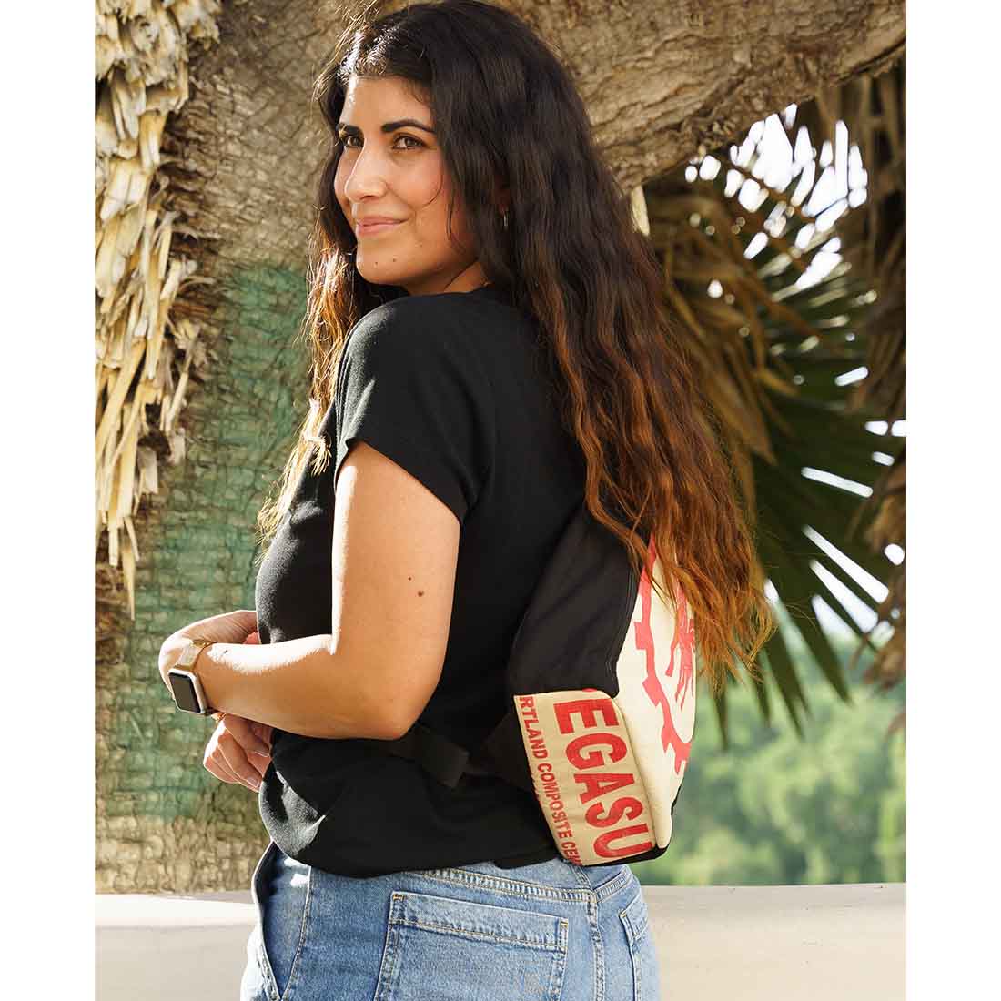 women wearing recycled sling backpack - pegasus