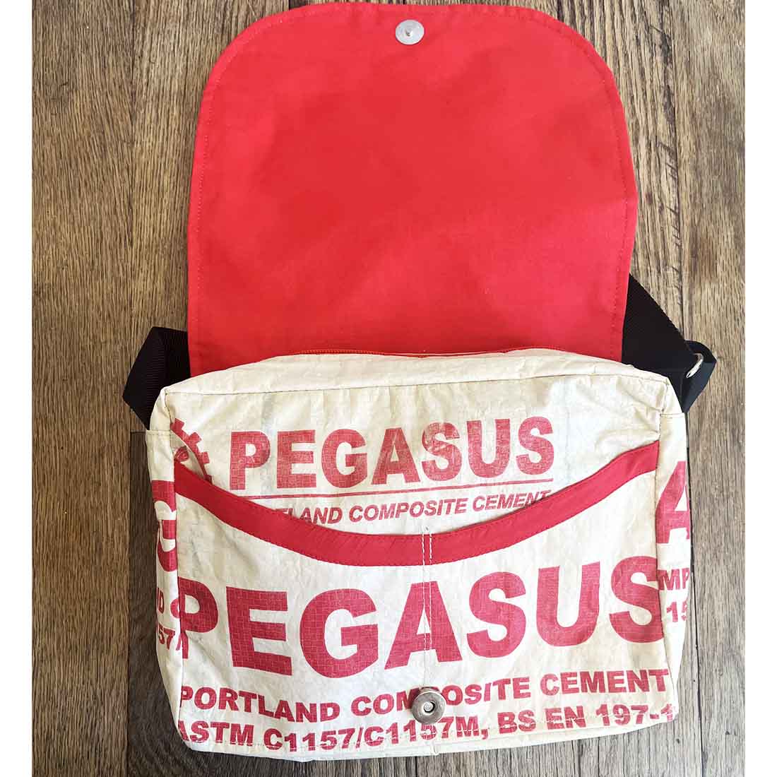 interior of small recycled messenger bag with red lining