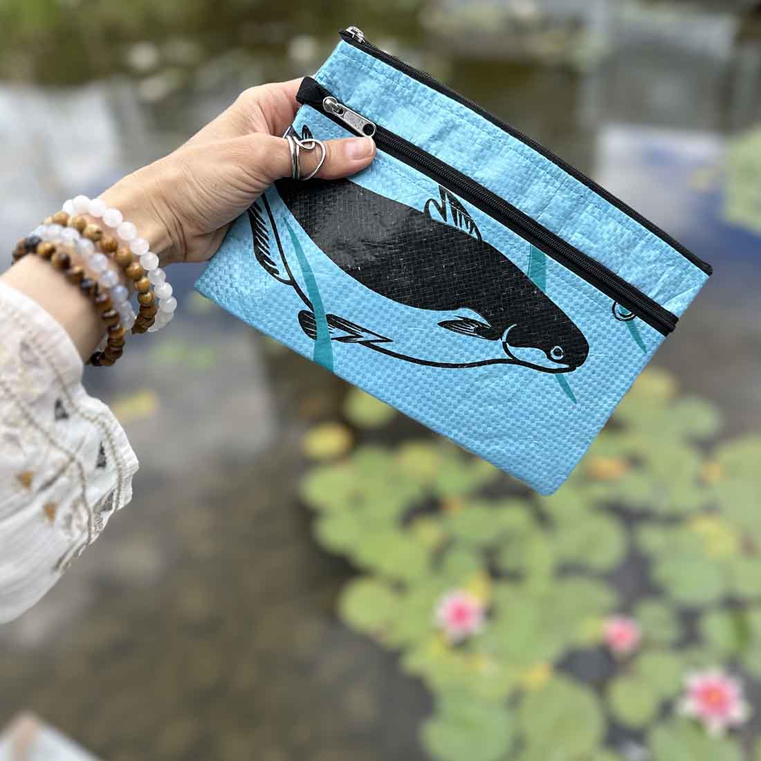 lite blue recycled zip pouch with fish