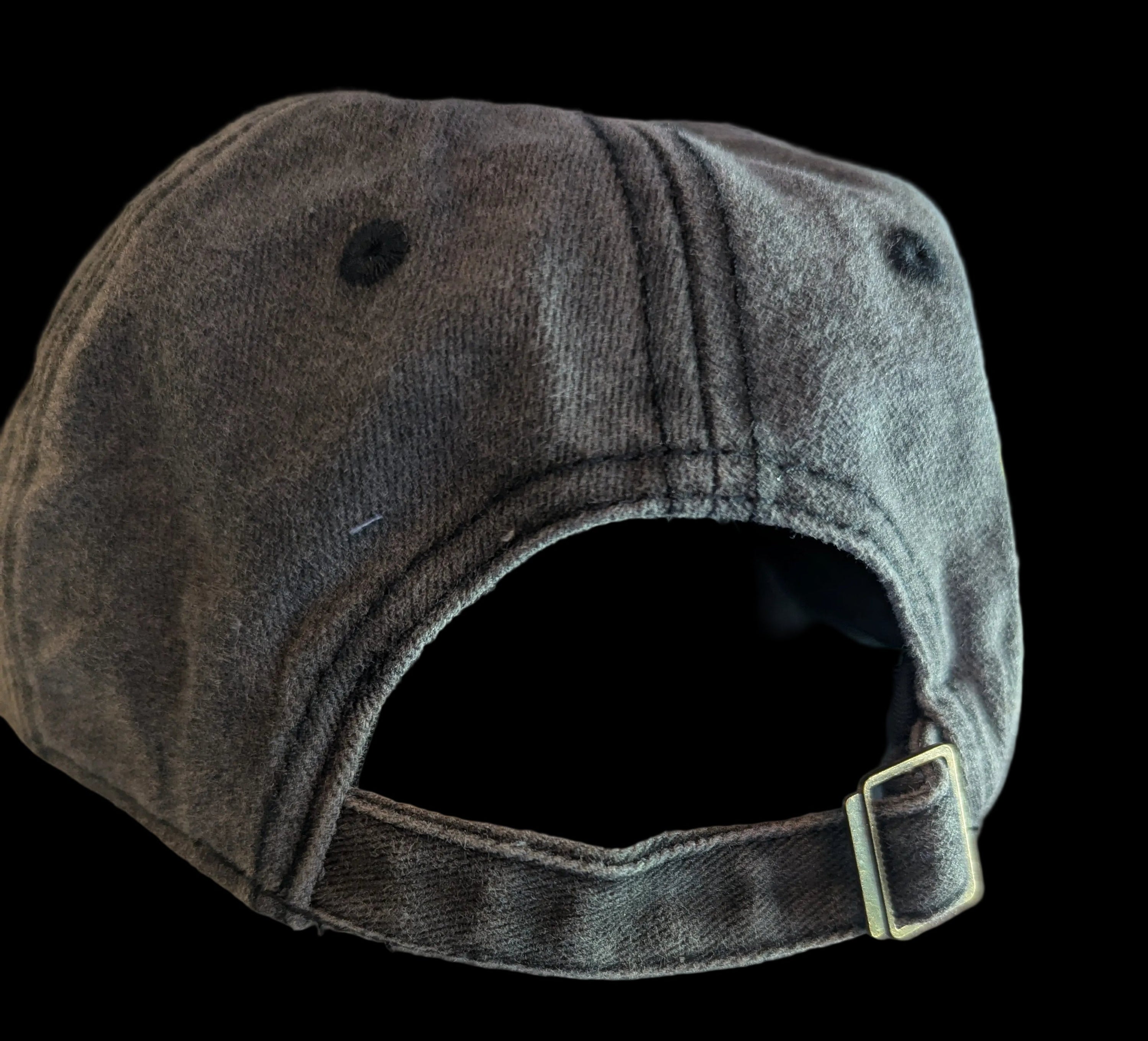 Vintage washes black/gray cap with a buckle on a black background